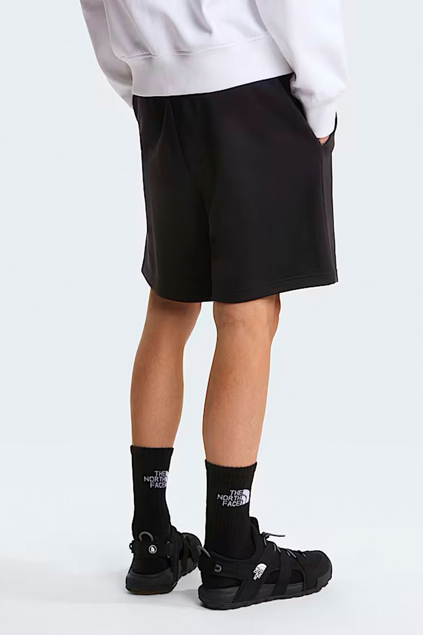 The North Face Box NSE Light Regular Shorts black back view showing functional pockets and Box NSE graphics