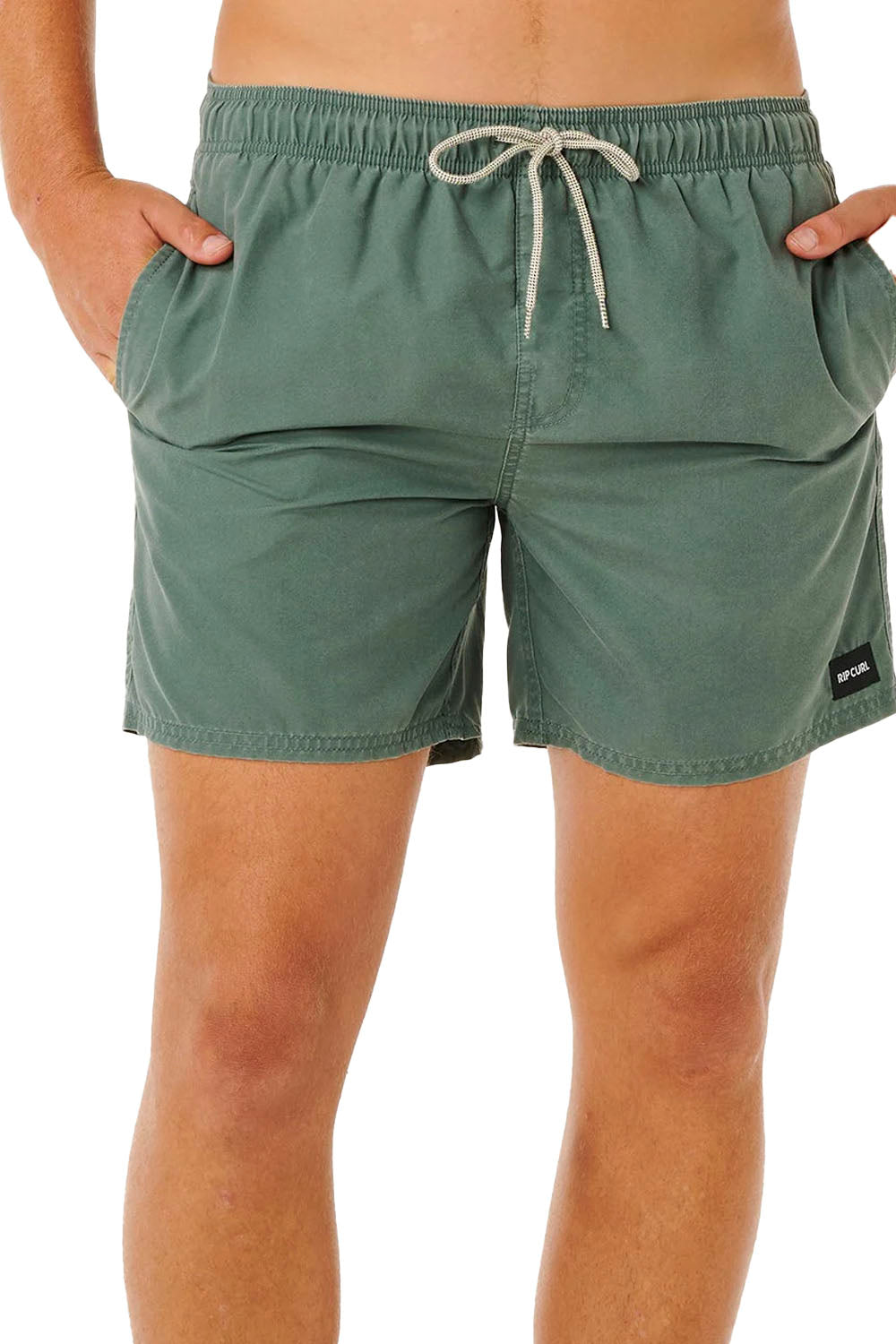 Green swim shorts with a drawstring on a white background