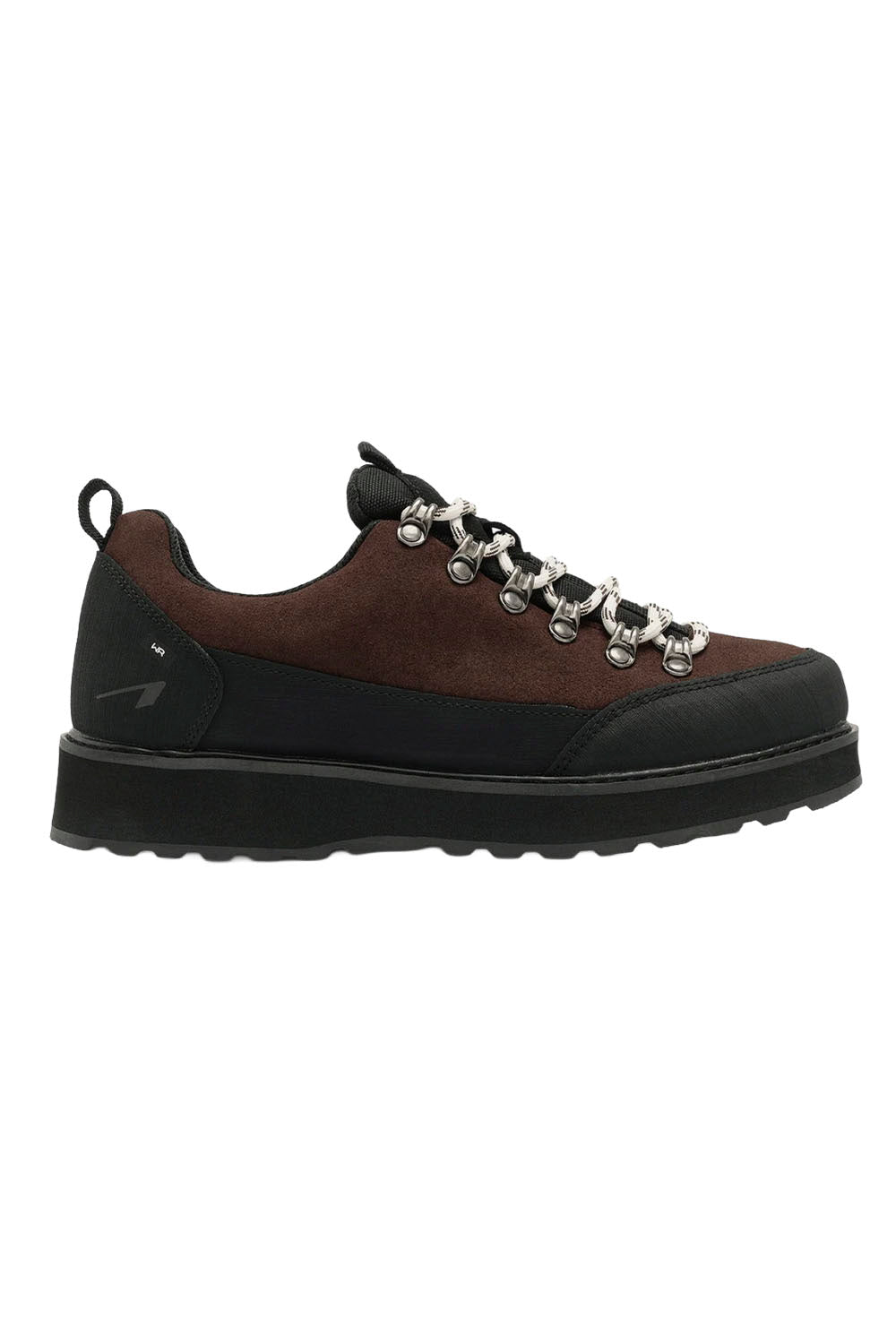 A pair of low-top sneakers shown from a top-down view on a plain white background. The shoes feature a dark brown upper, thick black soles, and distinctive braided white and black laces.