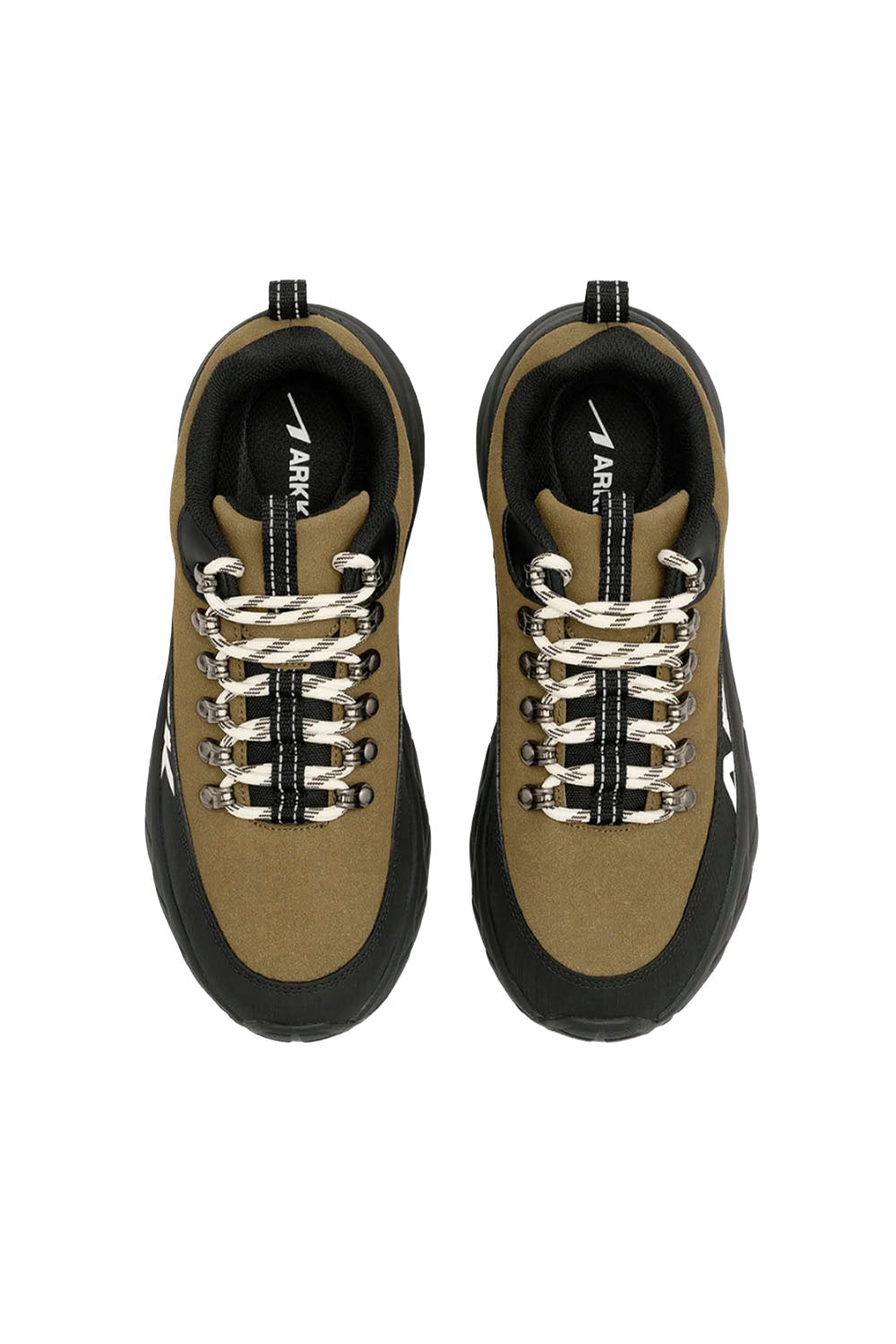 A pair of low-top sneakers shown from a top-down view on a plain white background. The shoes feature a tan and black upper with white and black laces, and the brand name 'ARKK' is visible on the tongue.