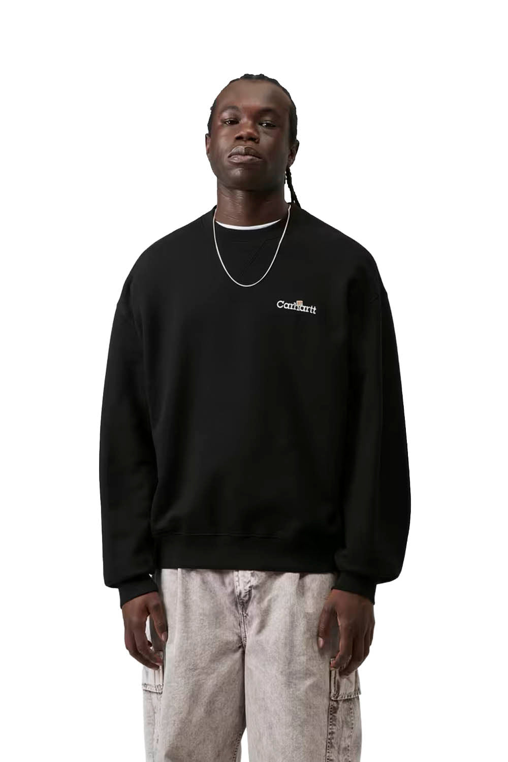 Person wearing a black sweatshirt with a brand logo on a white background