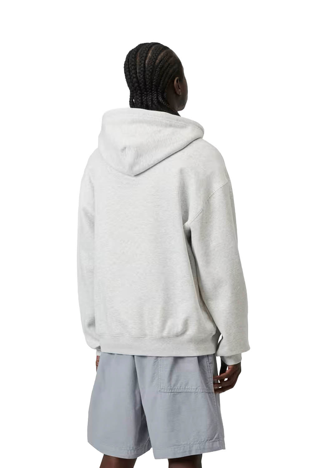 Person wearing a light gray hoodie and shorts on a white background