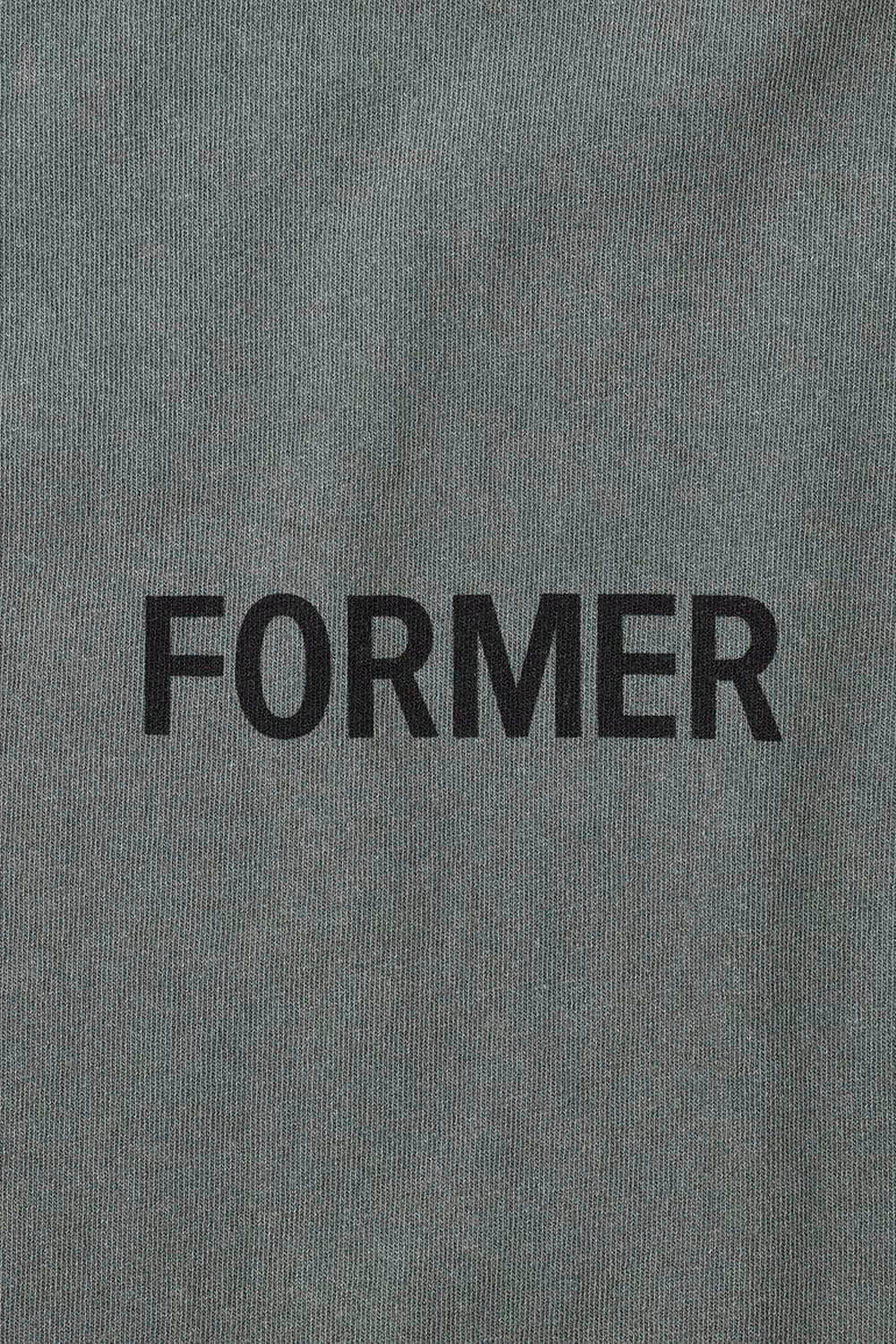 Gray fabric with 'FORMER' printed in black text