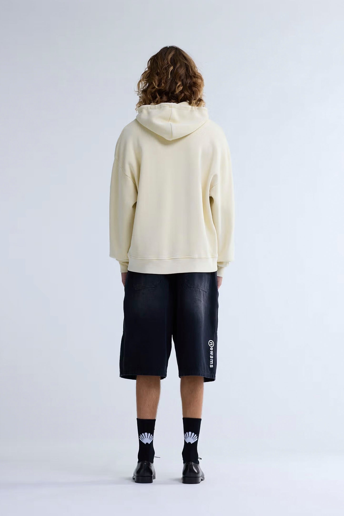 NEW AMSTERDAM SURF ASSOCIATION PLATE HOODIE - Front view featuring ribbed textured fabric and cotton drawcords