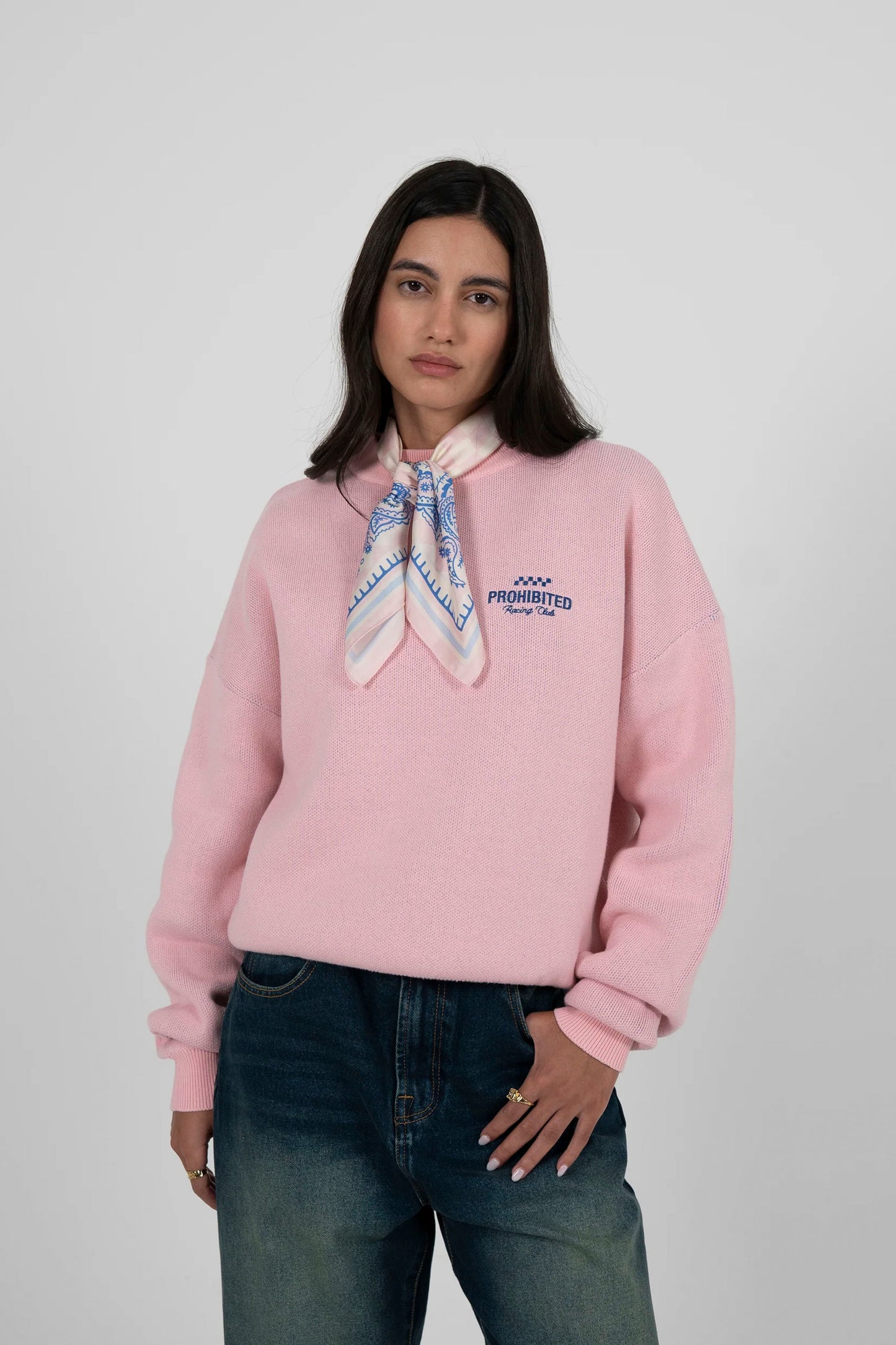 Woman wearing PROHIBITED Vortex knit sweater in rose