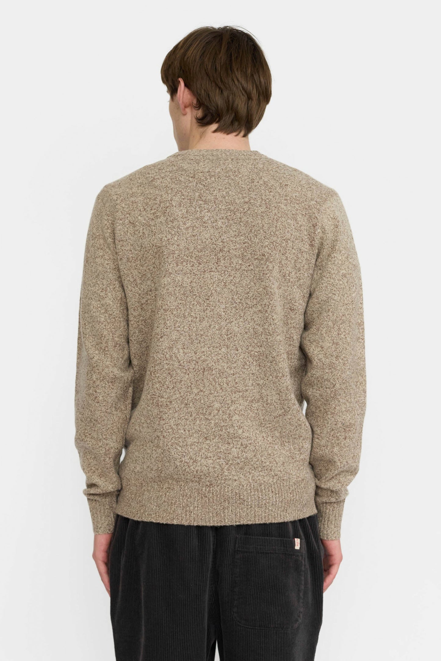 Revolution Beige sweater and black pants Pukas Surf Shop