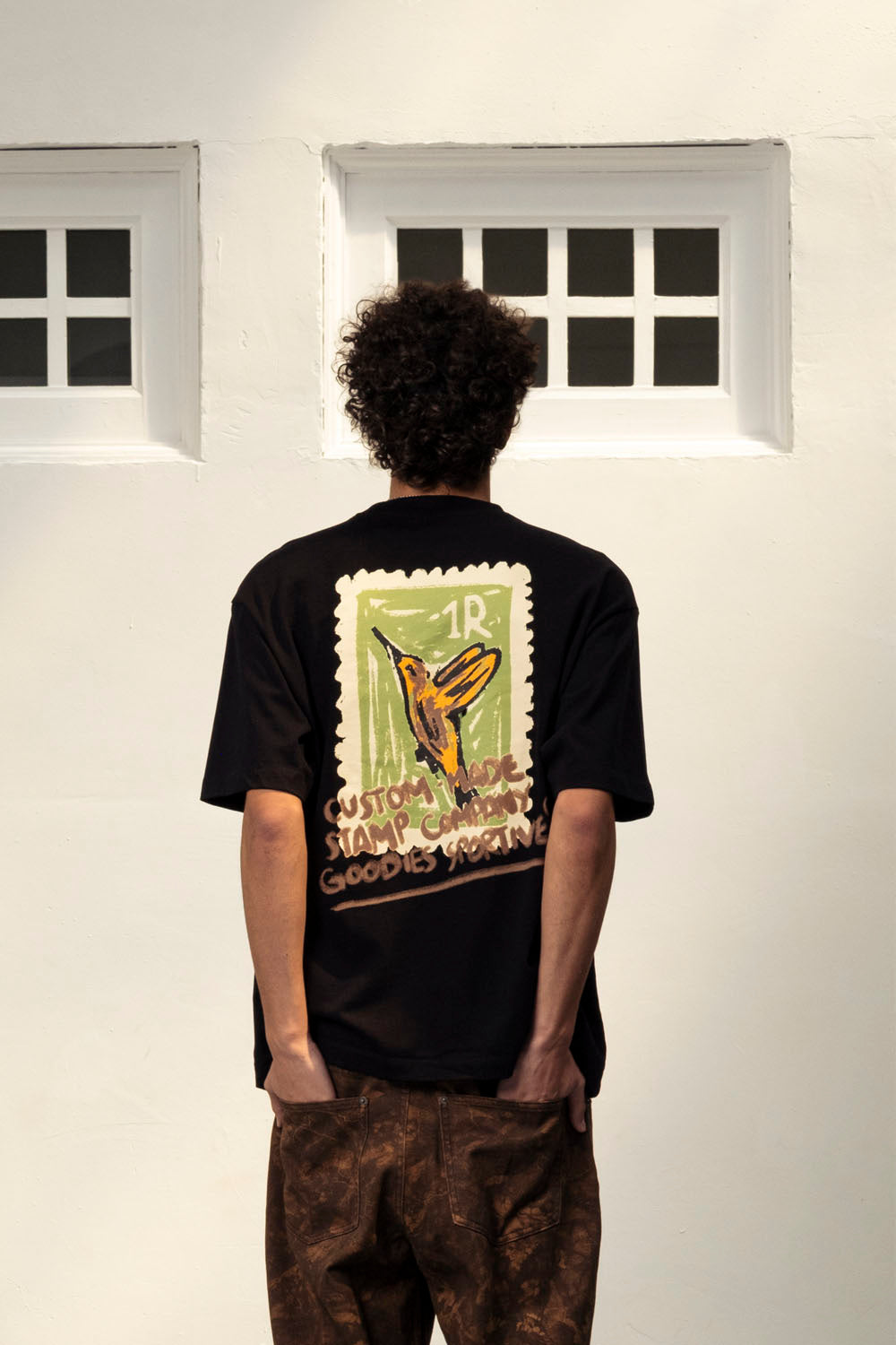 Goodies Sportive Stamp Company Tee in Black - Men's Oversized Graphic T-Shirt at Pukas Surf Shop
