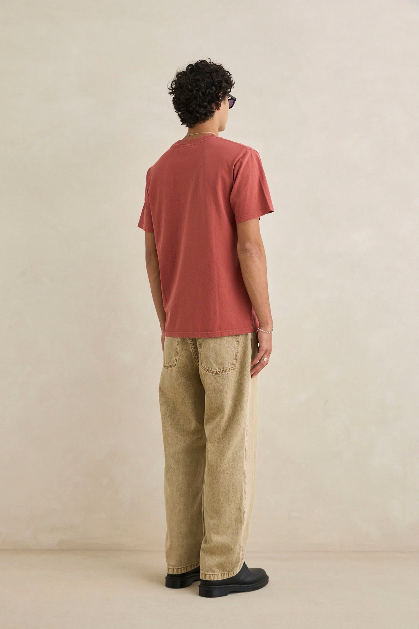 Man wearing Rhythm vintage clay pocket tee - lifestyle shot showcasing dropped shoulders and relaxed fit