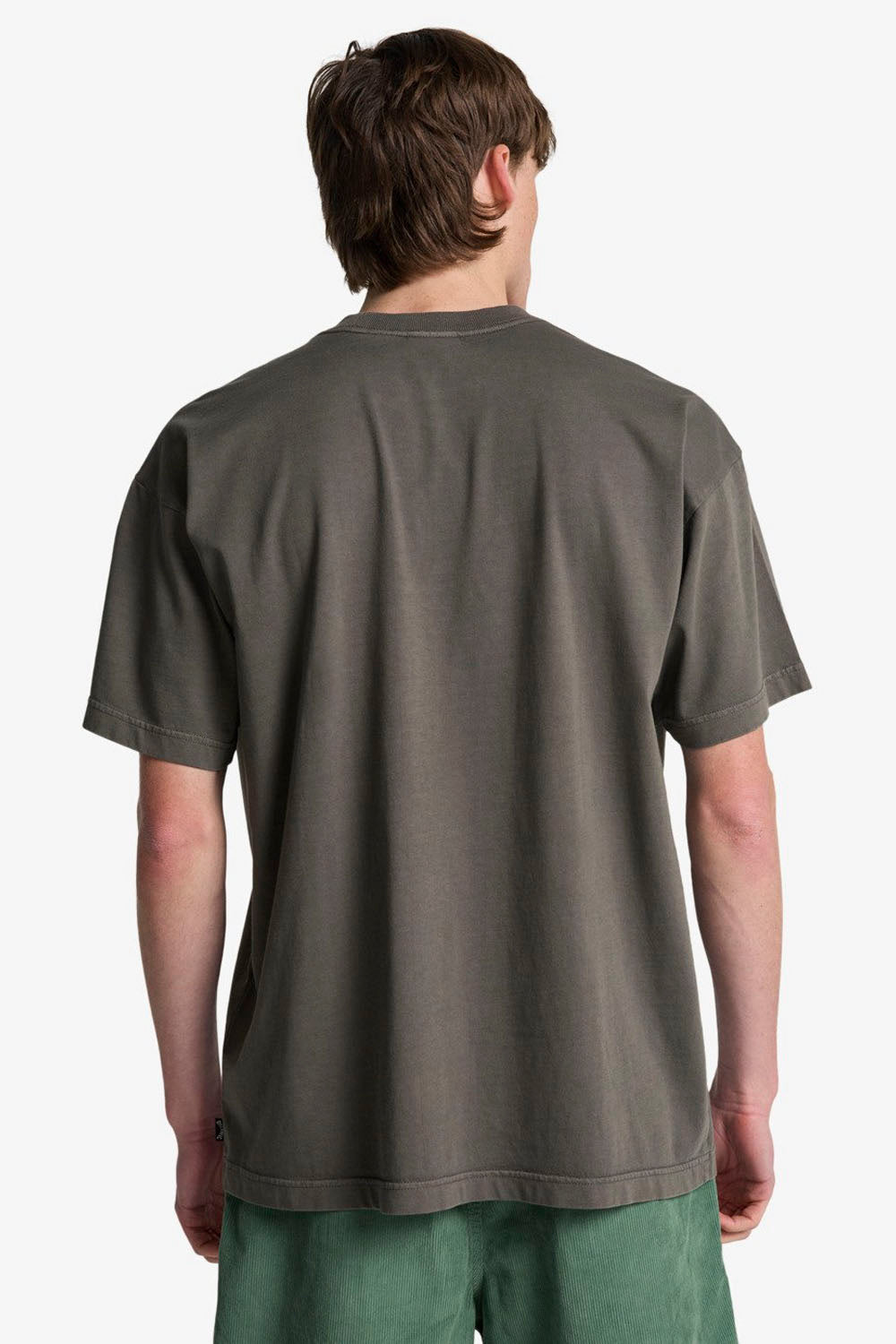 Person wearing a plain dark gray t-shirt on a white background