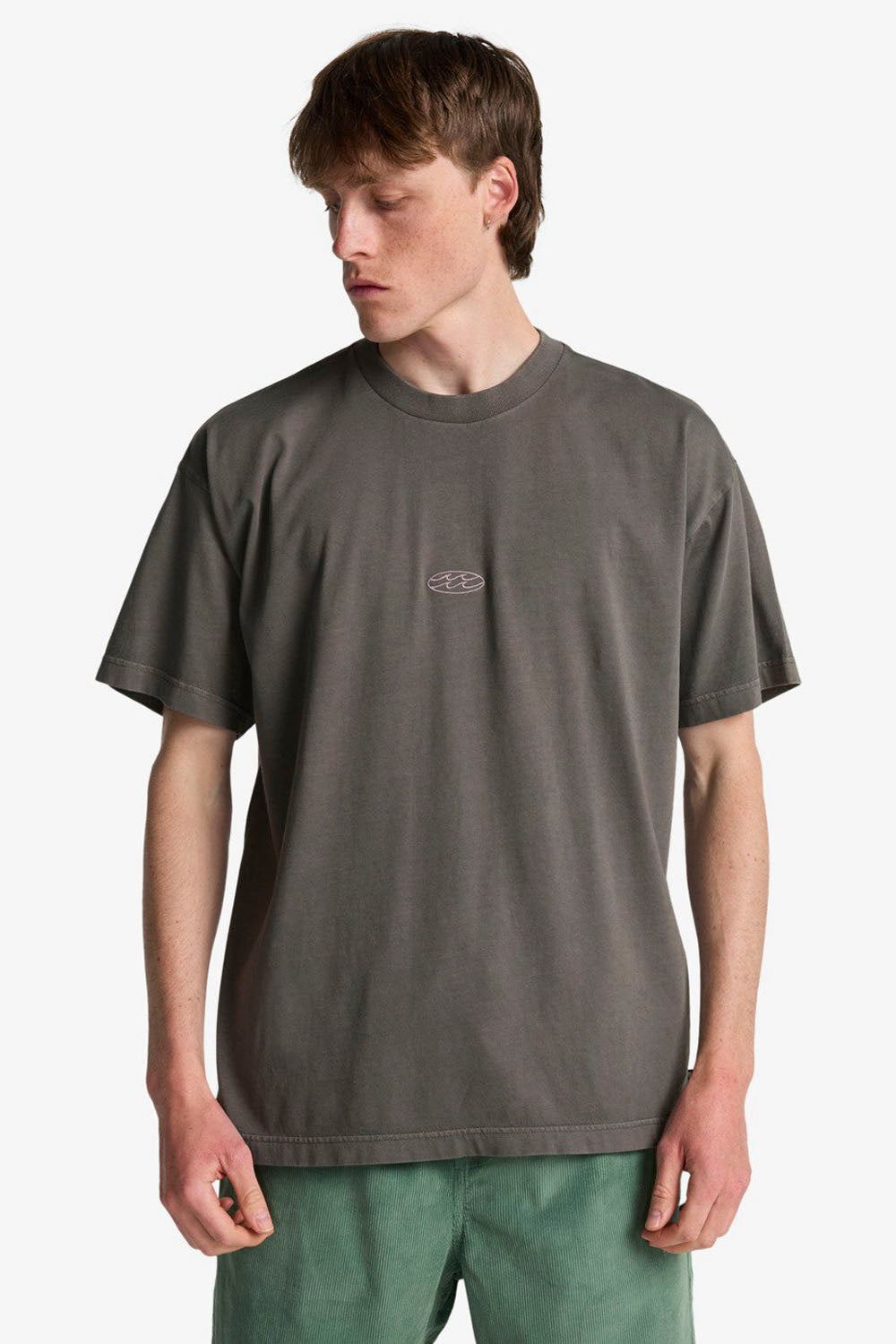 Person wearing a dark gray t-shirt with a small logo on a white background