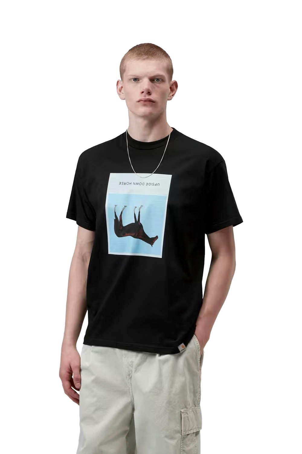 Man wearing a black t-shirt with a graphic design on a white background