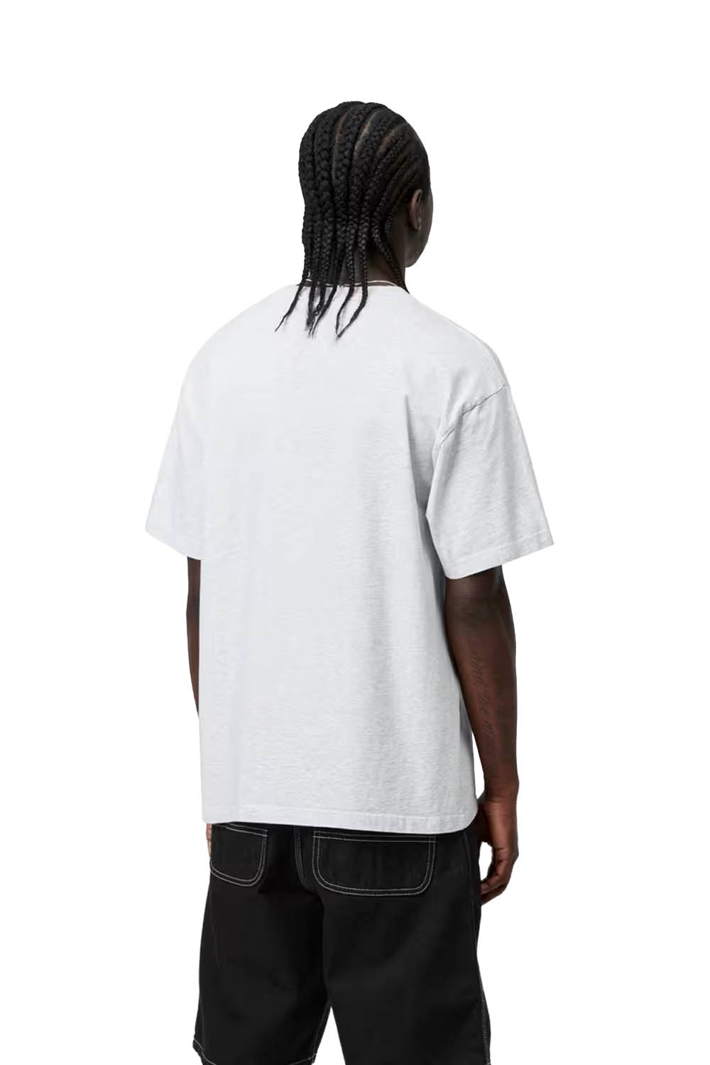 Person wearing a plain white t-shirt on a white background