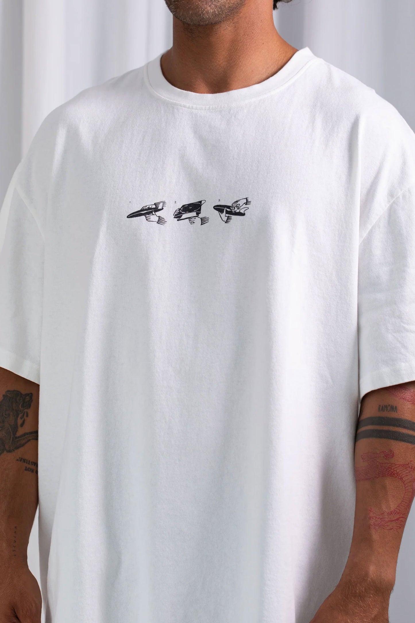 Latitud fuego x Pukas Surf Shop White t-shirt with black graphic design and text on the back 