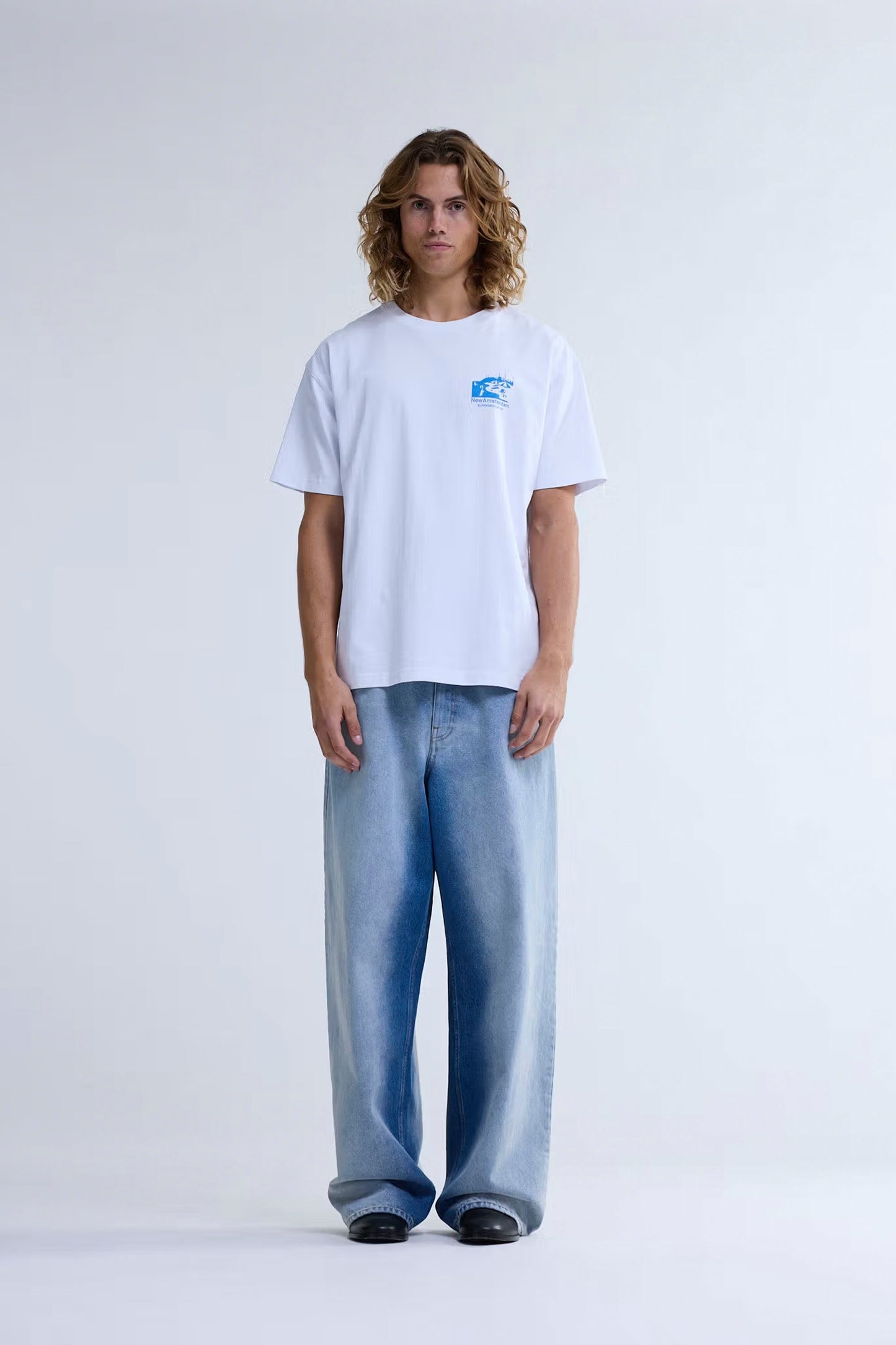 New Amsterdam Surf Association Beach Sign tee crew neck front view with Wijk aan Zee beach sign screenprinted artwork