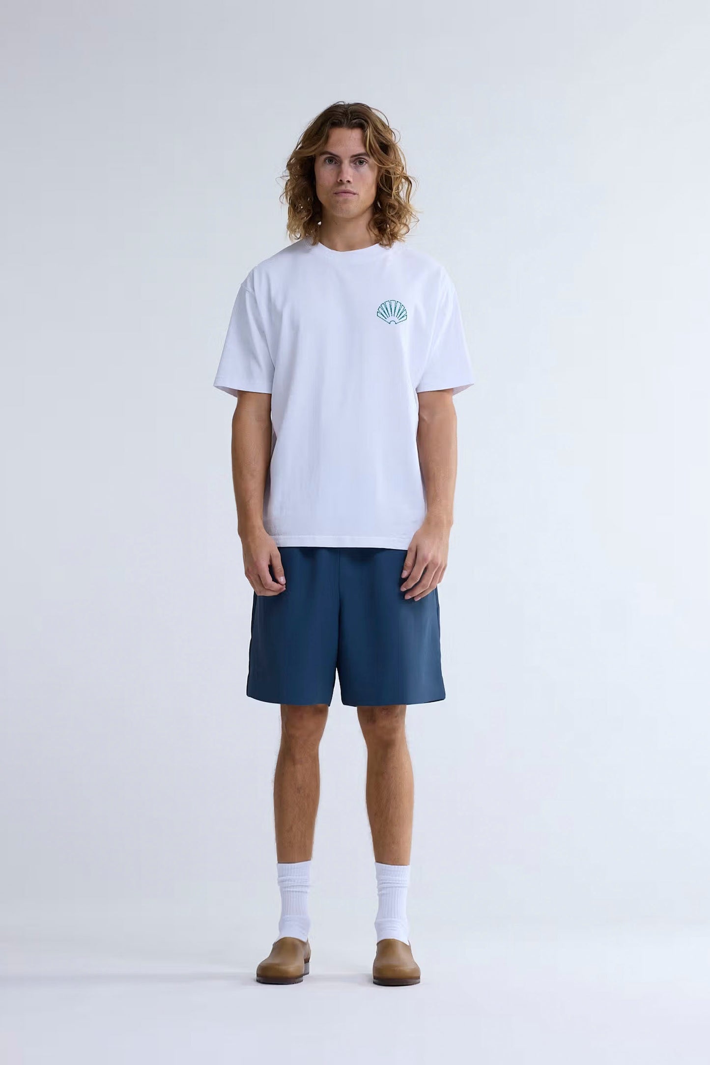 New Amsterdam Surf Association Logo Tee white sea green crew neck front view with high-low embroidered logo