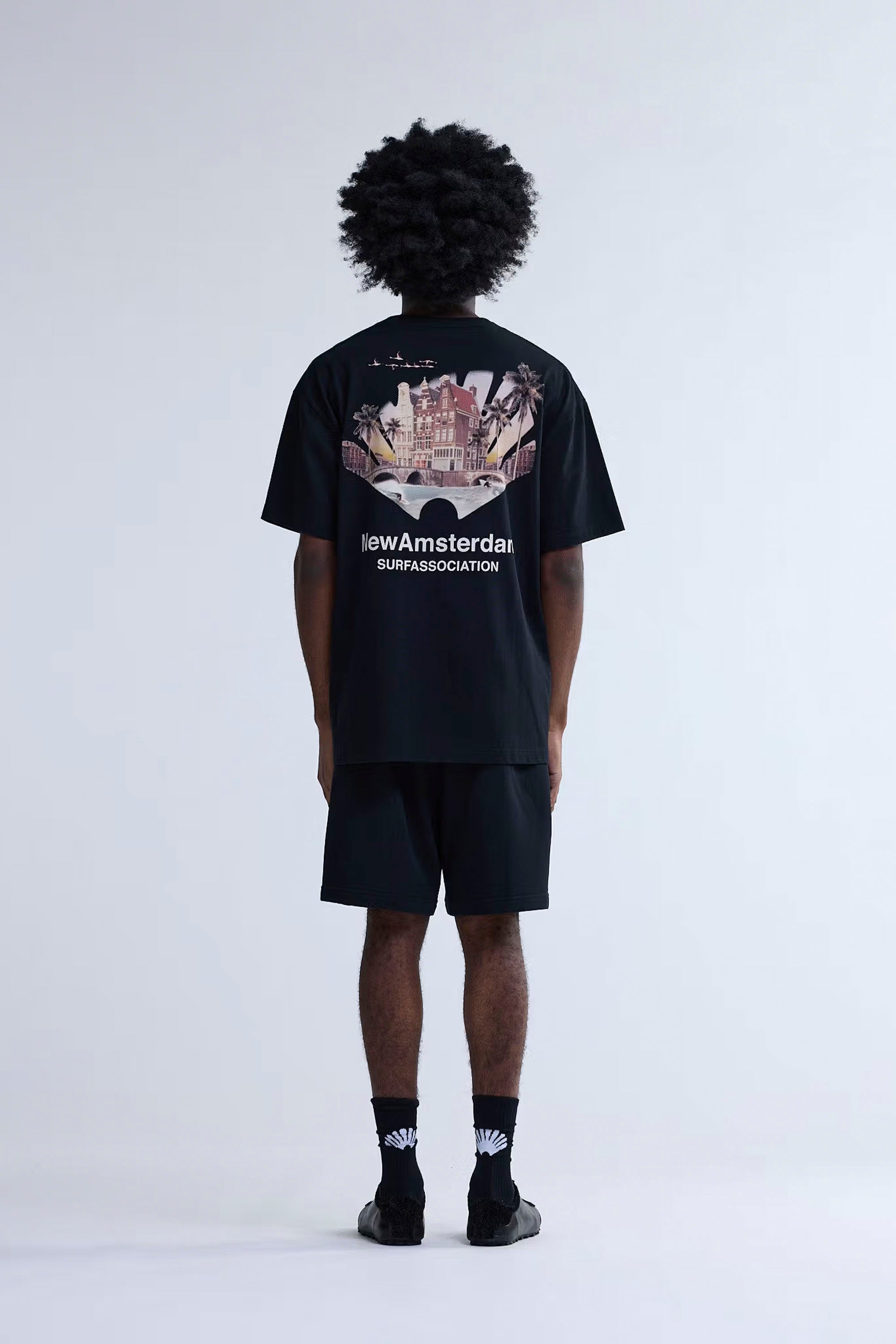 New Amsterdam Tropical Tee Black | Shop at PUKAS SURF SHOP