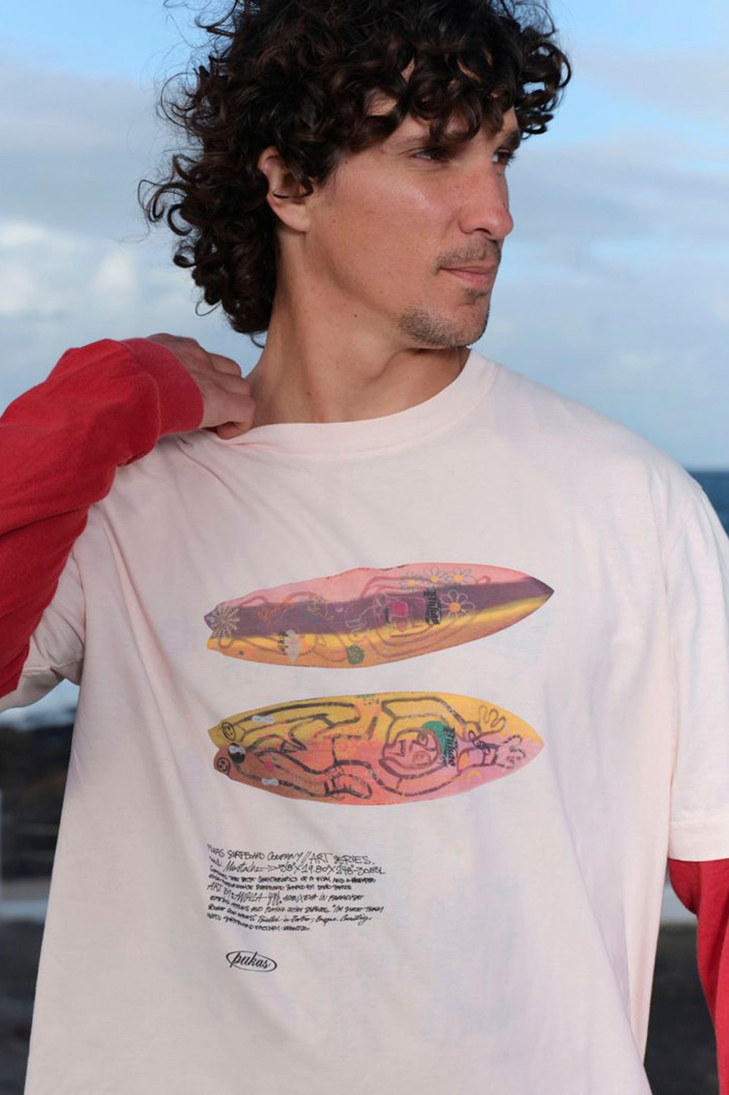PUKAS Art Series Tee in ash rose featuring exclusive surf-inspired graphic design