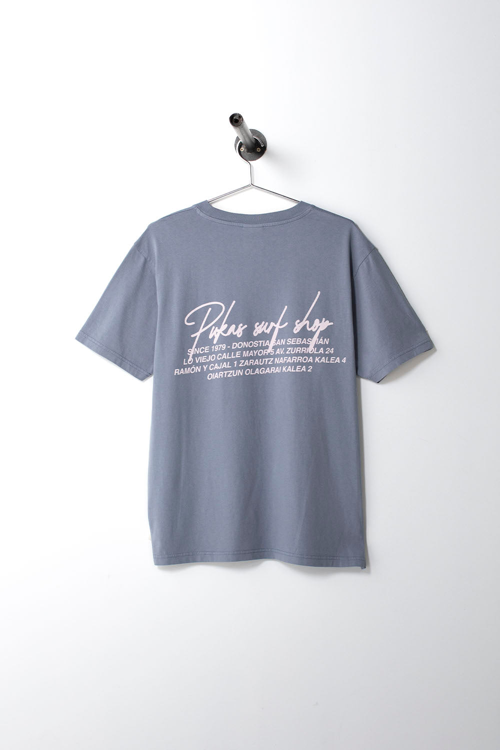 Gray t-shirt with white text on a hanger against a white background