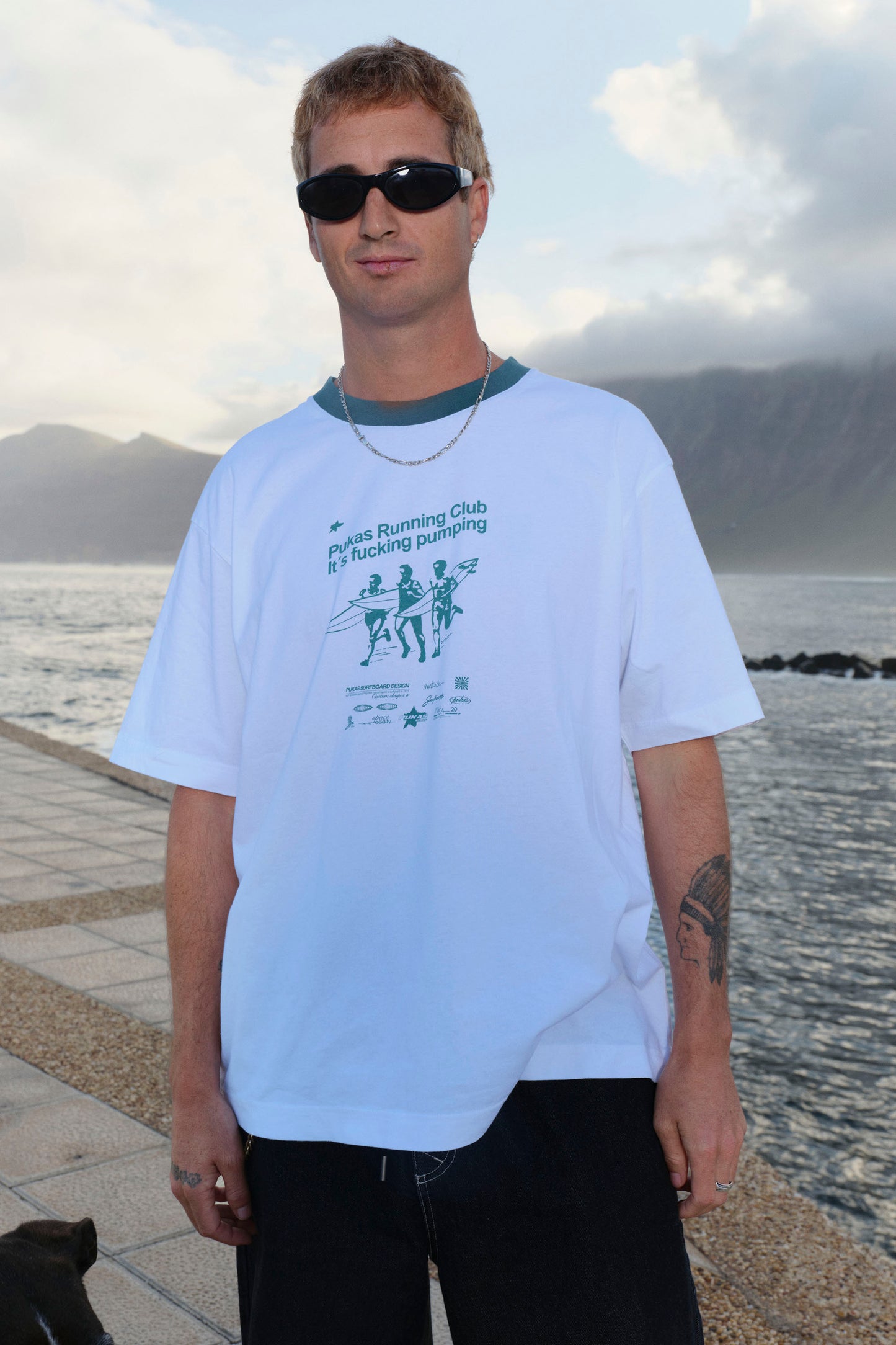 Man wearing Pukas Running Club tee 