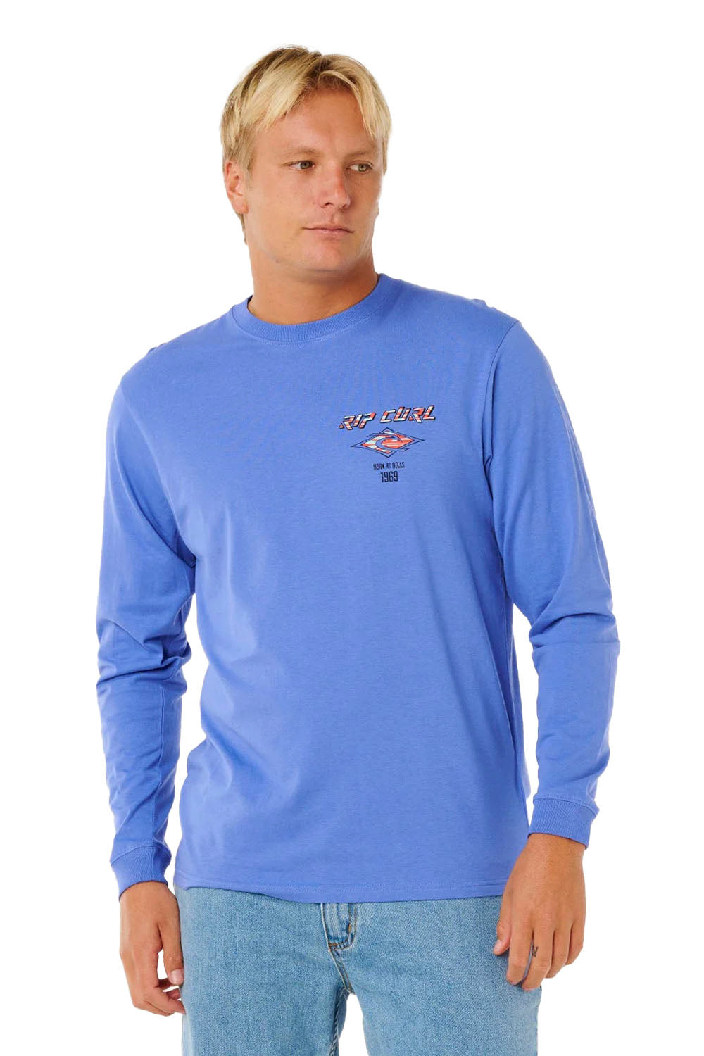 Man wearing a blue long-sleeve shirt with a logo on a white background