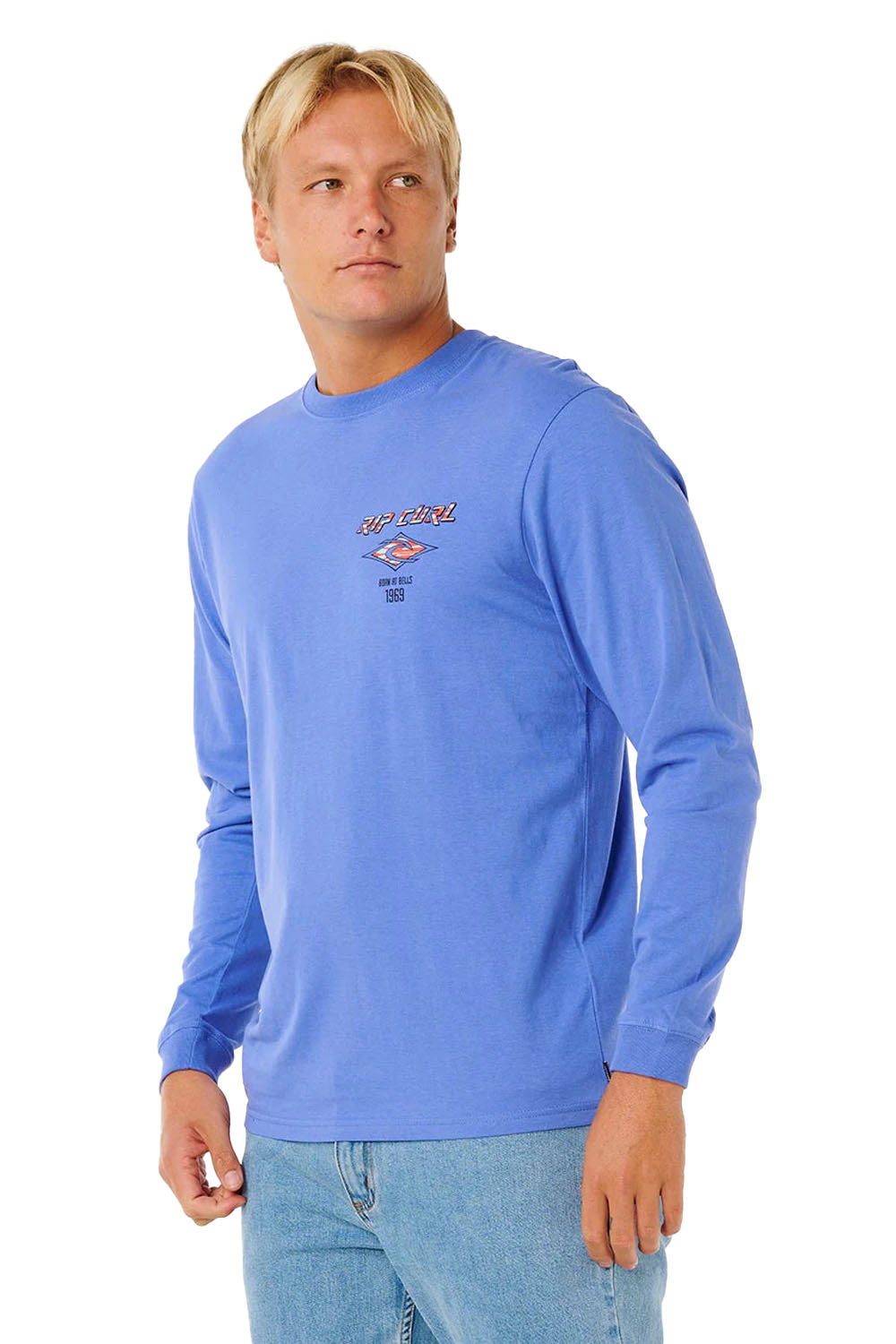 Man wearing a blue long-sleeve shirt with a logo on a white background
