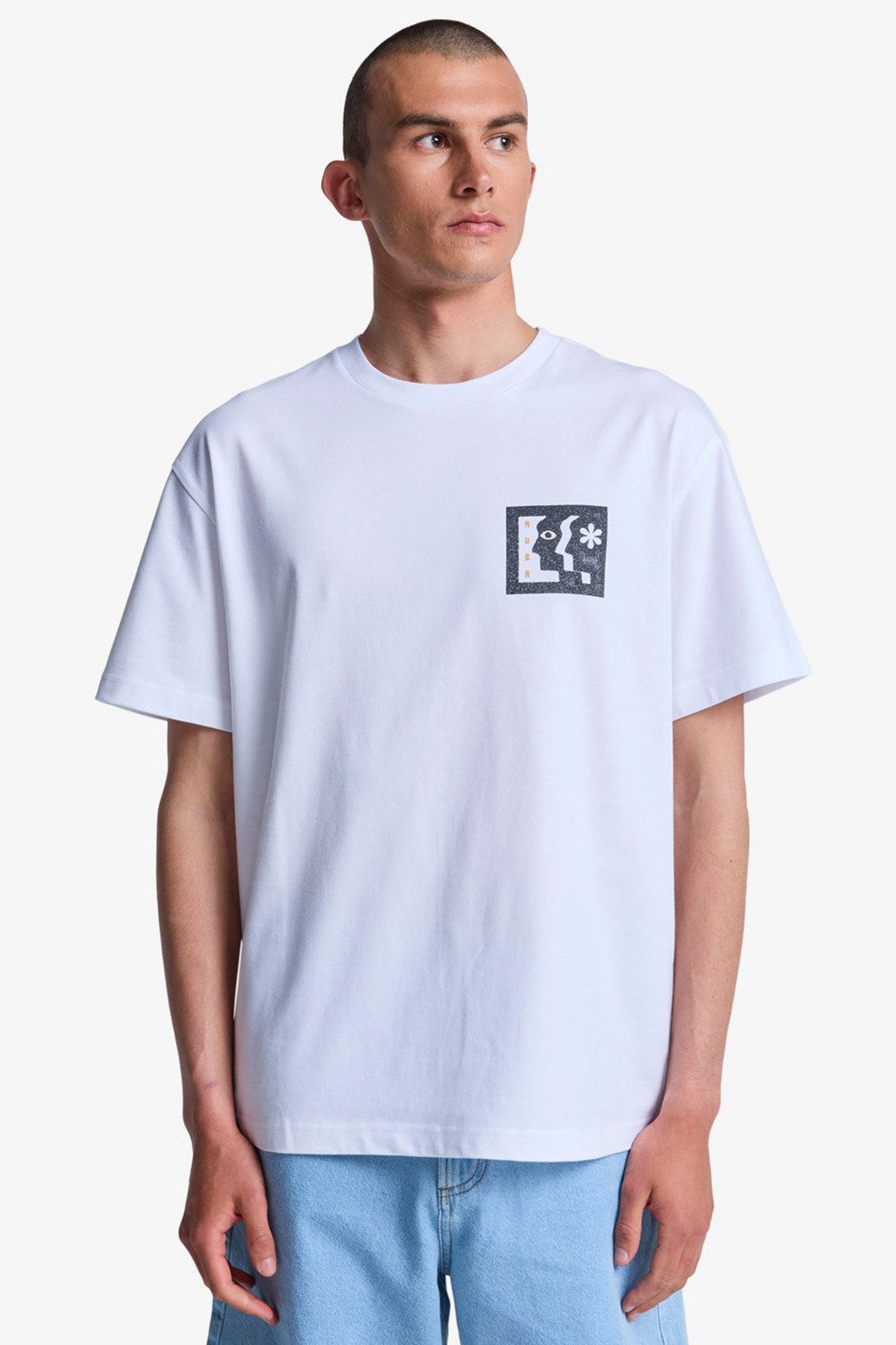 Man wearing a White Rvca Face to face tee on a white background 