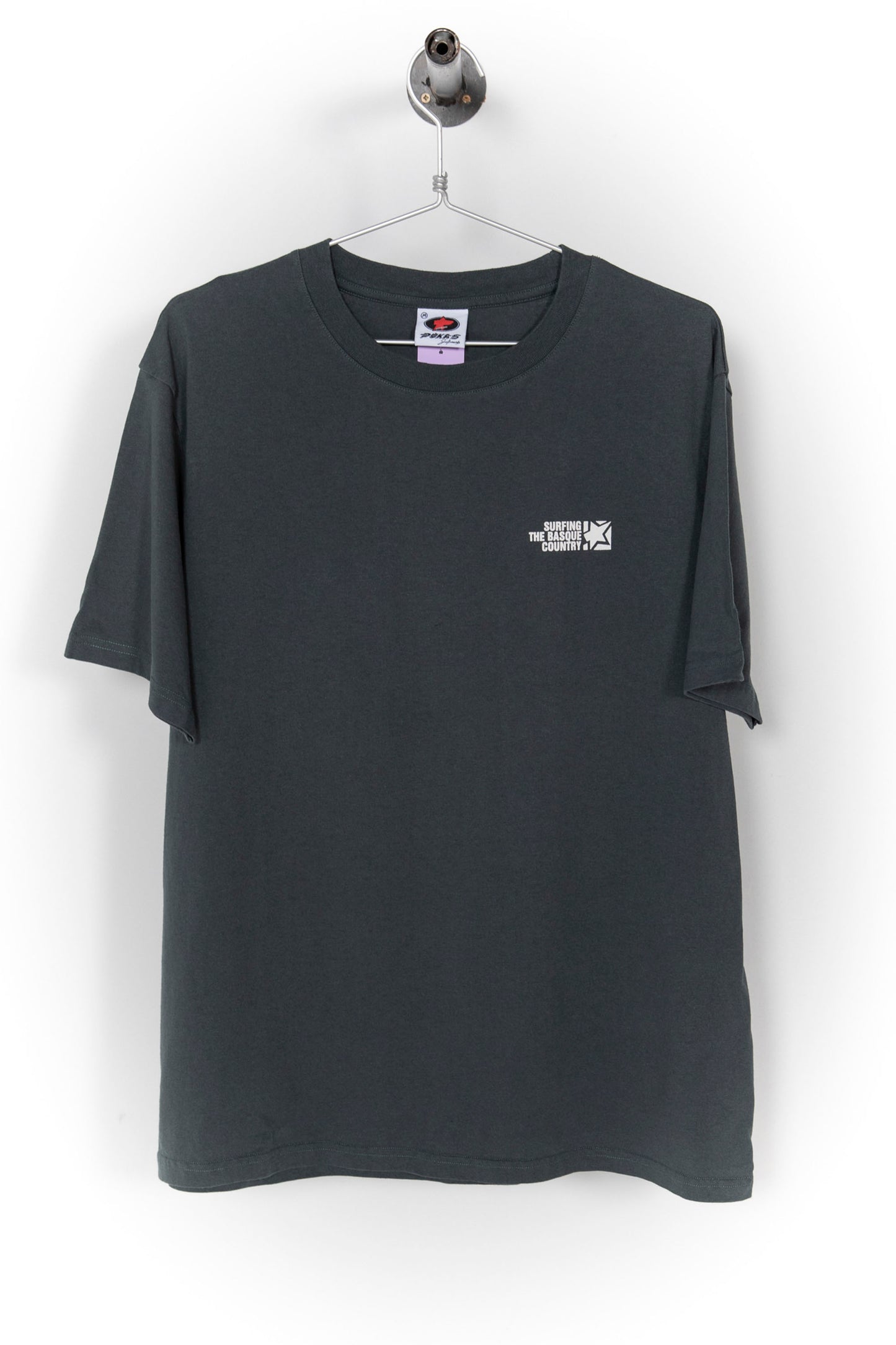 Pukas Surf Shop charcoal t-shirt Surfing the Basque Country front logo and bold back print