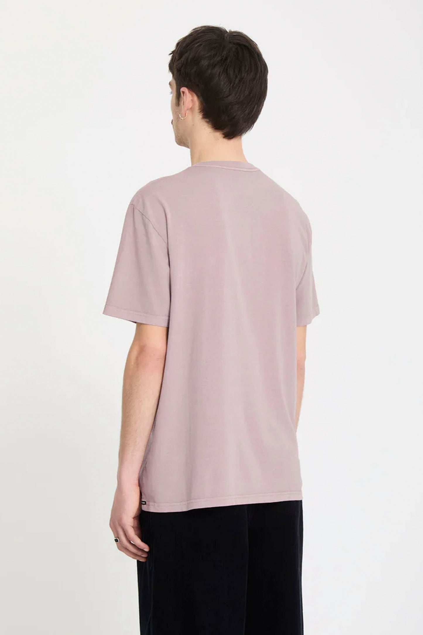 Person wearing a Bark brown Volcom Solid Stone Emb t-shirt on a white background