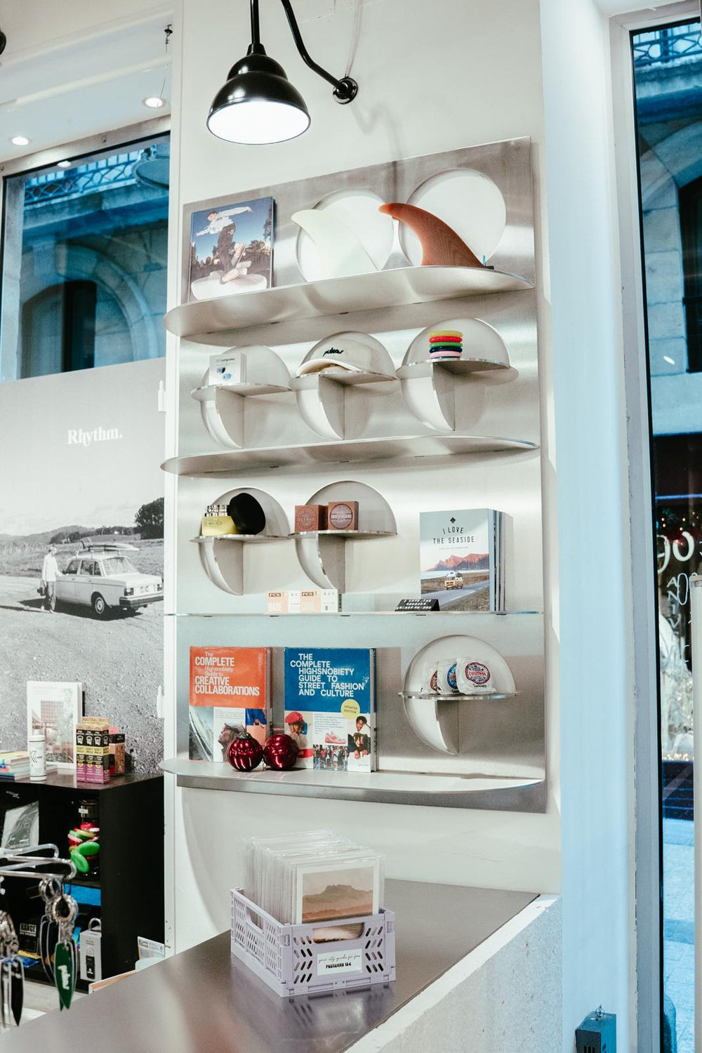 Shelf with hats and books in a store setting