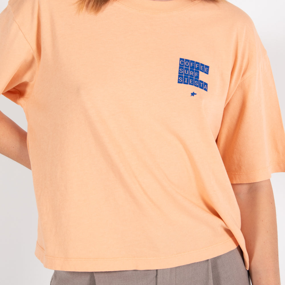 Pukas-Surf-Shop-Surfing-with-amigos-woman-coffee-surf-tee-orange