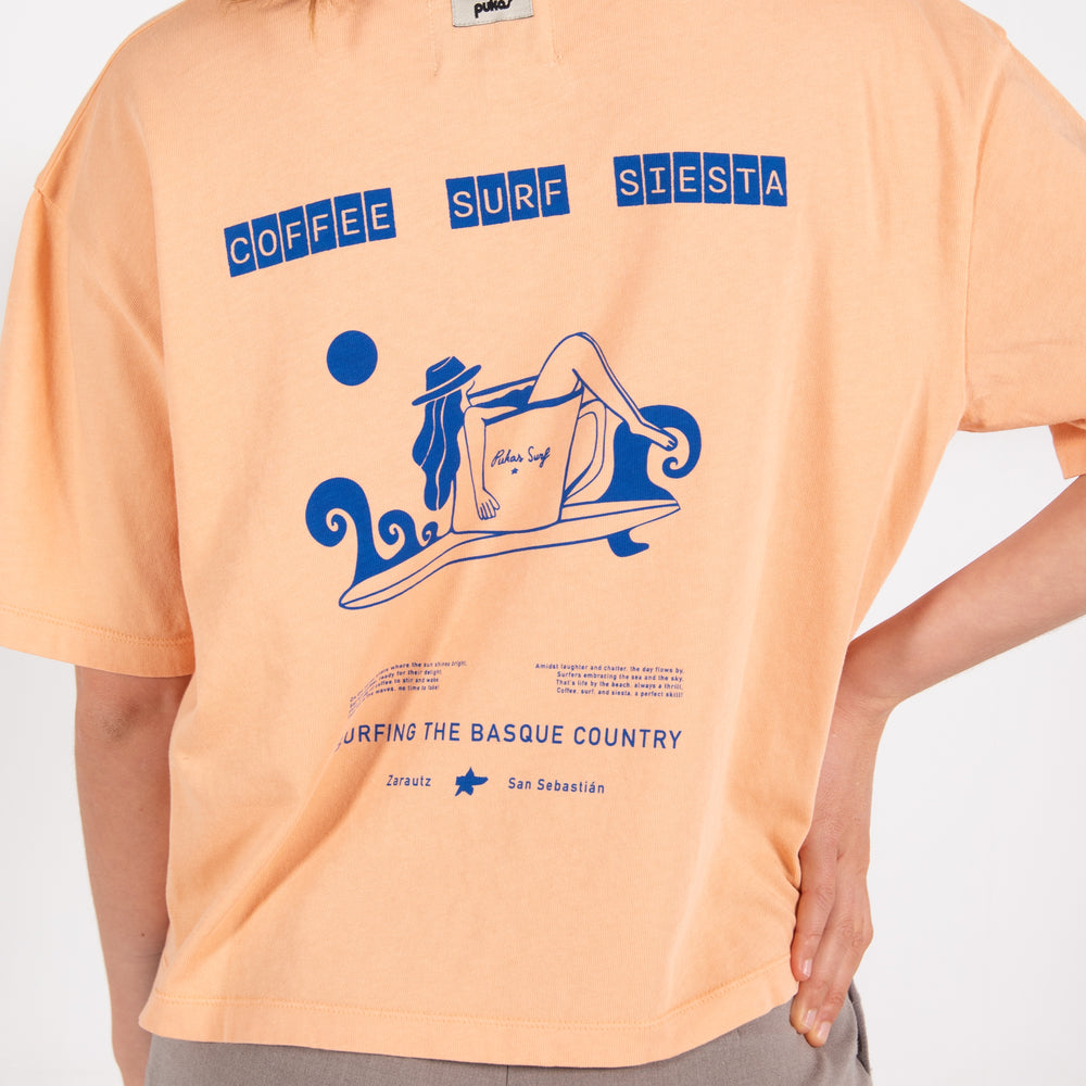 Pukas-Surf-Shop-Surfing-with-amigos-woman-coffee-surf-tee-orange