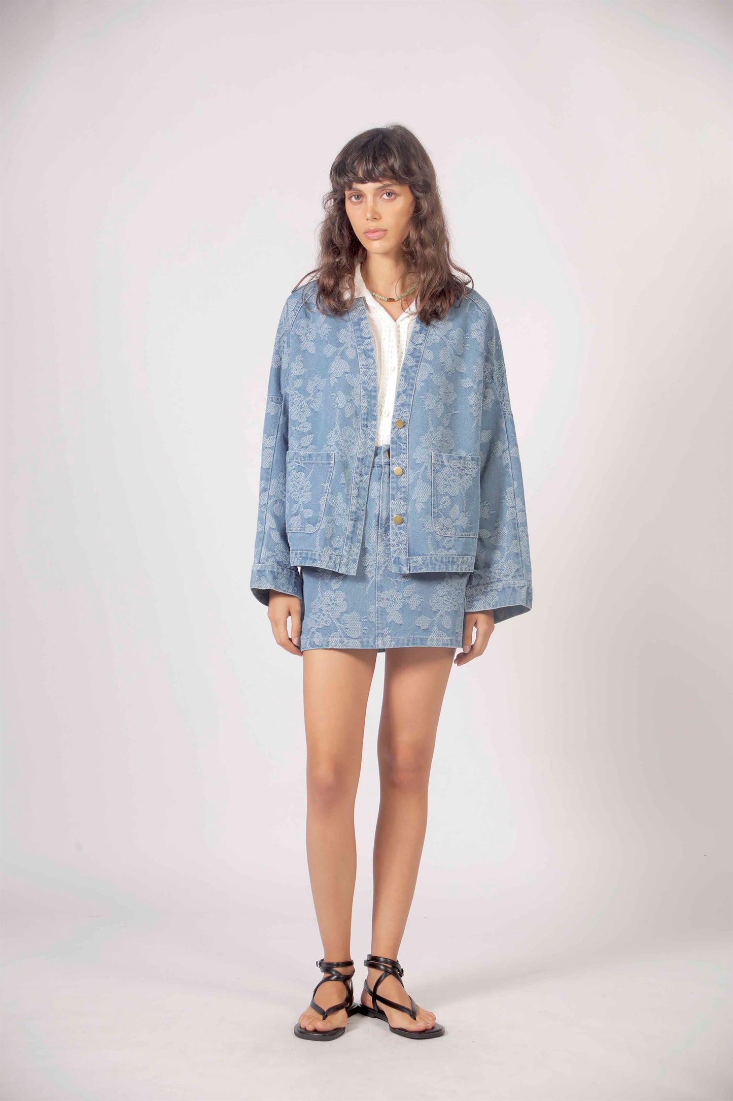 THE KORNER Denim Flowers Jacket in Blue - Women's denim jacket with floral embroidery
