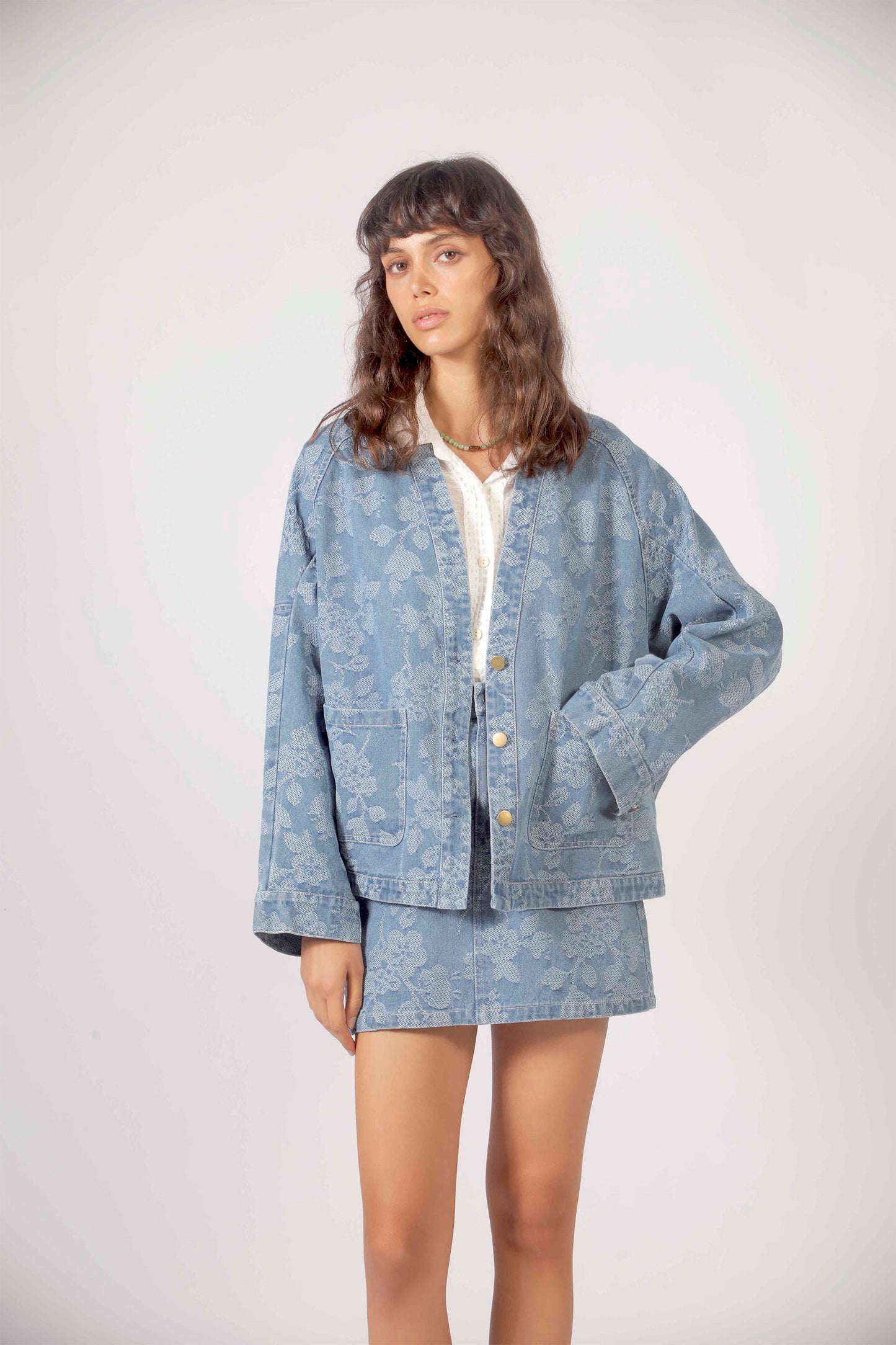 THE KORNER Denim Flowers Jacket in Blue - Women's denim jacket with floral embroidery
