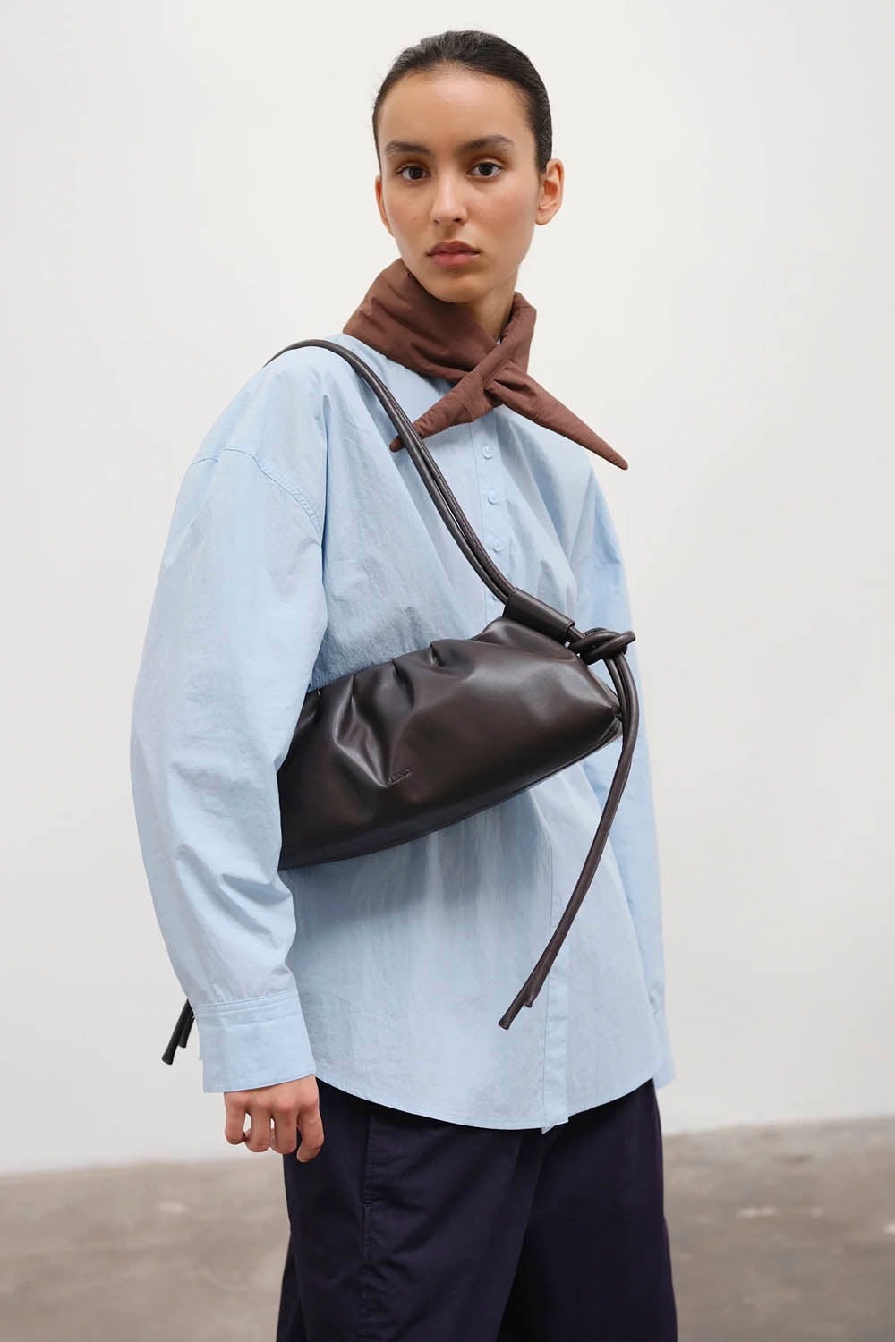 ÖLEND Dumpling Bag in Dark Chocolate vegan leather with gathered detailing and adjustable knotted handles
