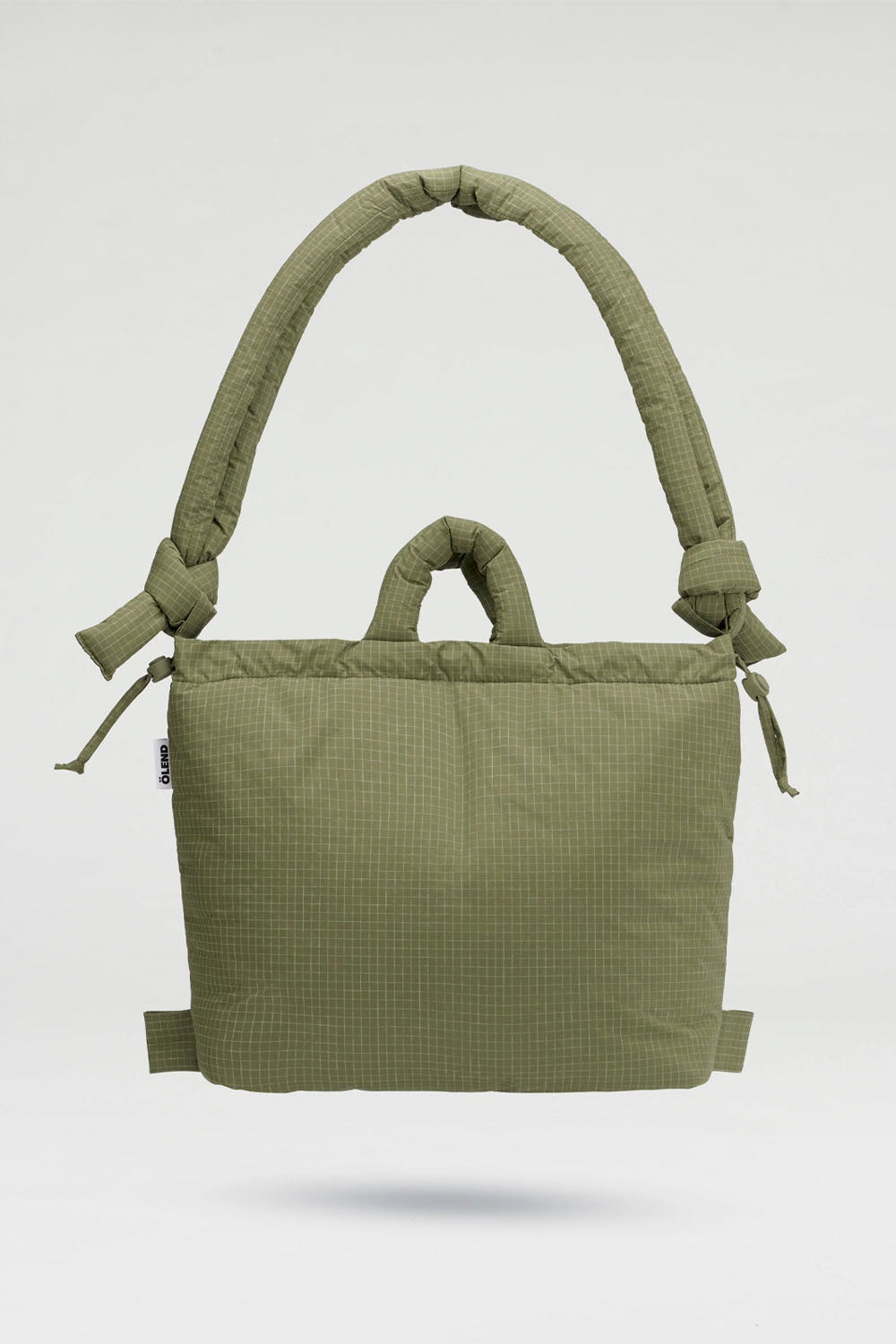 An olive green quilted backpack with a thick padded shoulder strap and top carry handle, shown against a light gray background.