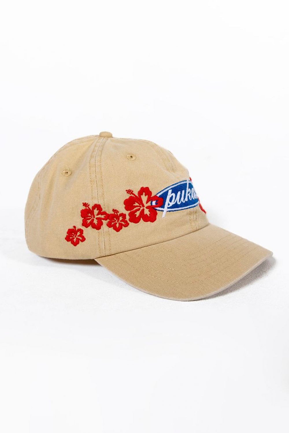 Beige cap with red floral design and blue logo on a white background