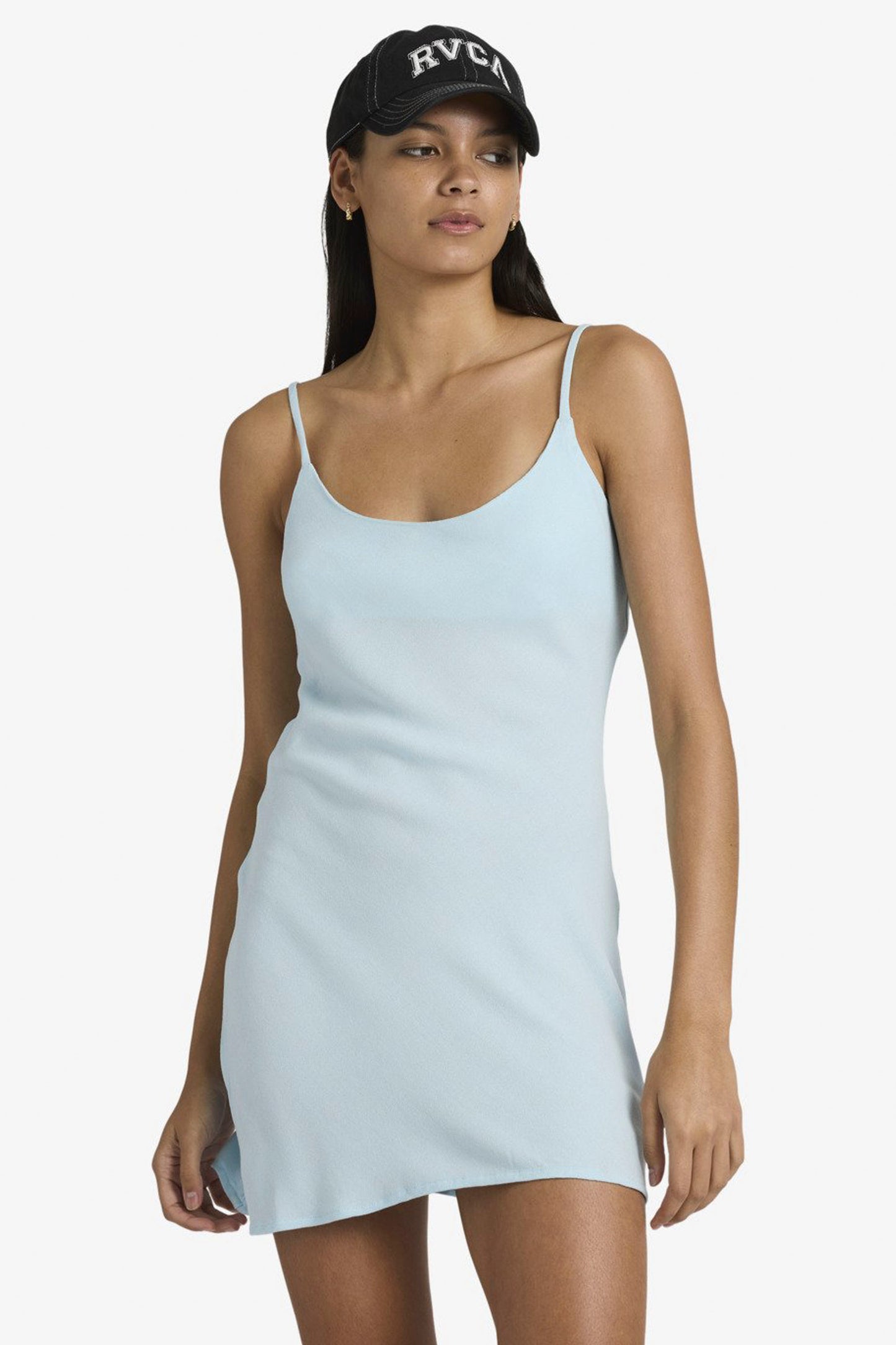 Woman wearing crystal blue Rvca Macarthur mini dress on a white background