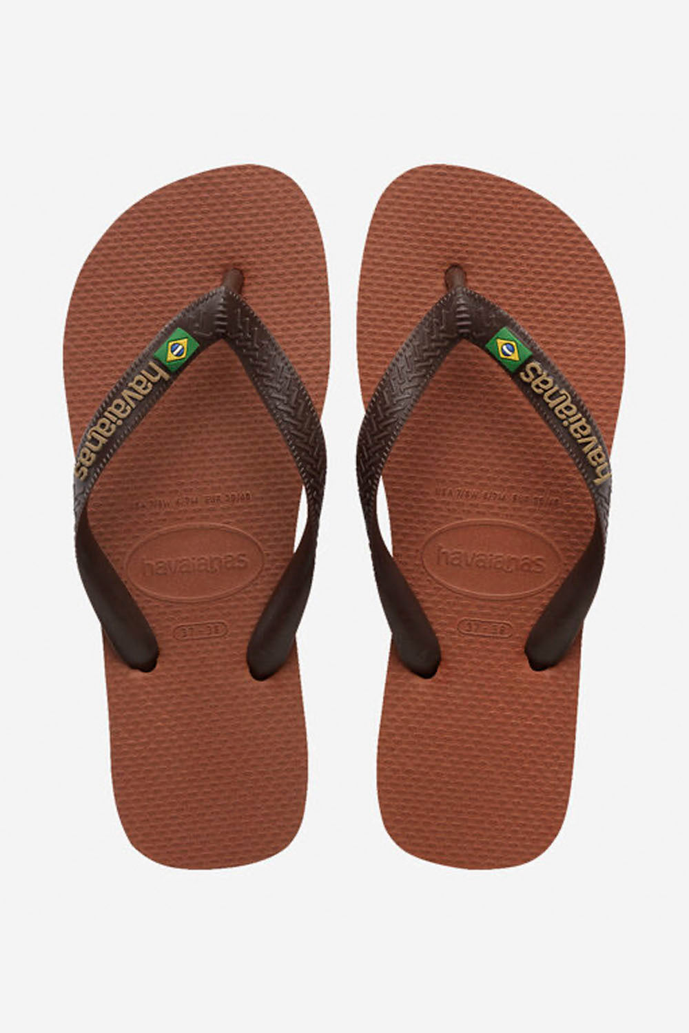 Pair of brown flip-flops with black straps on a white background
