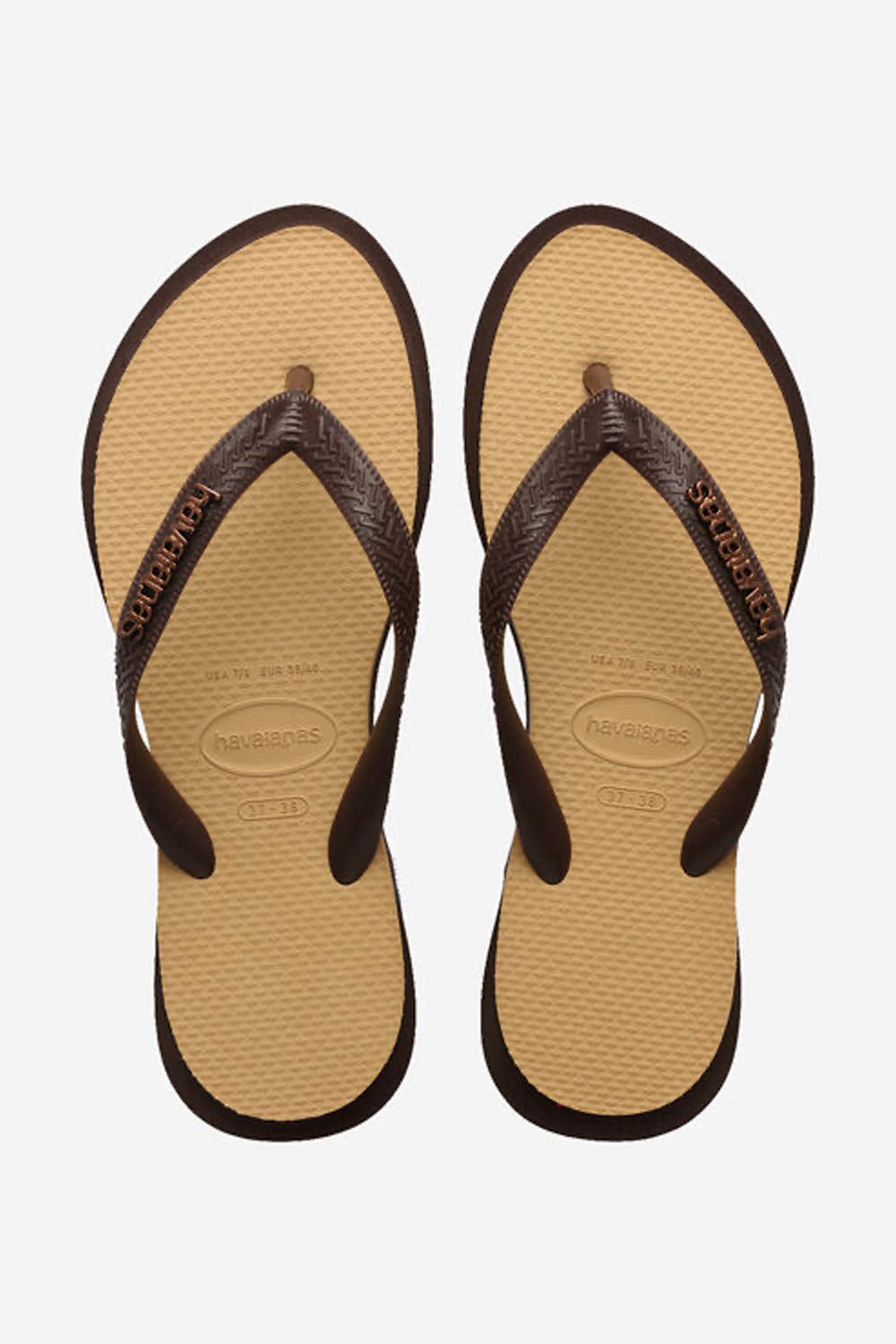 Pair of tan flip-flops with black straps on a white background
