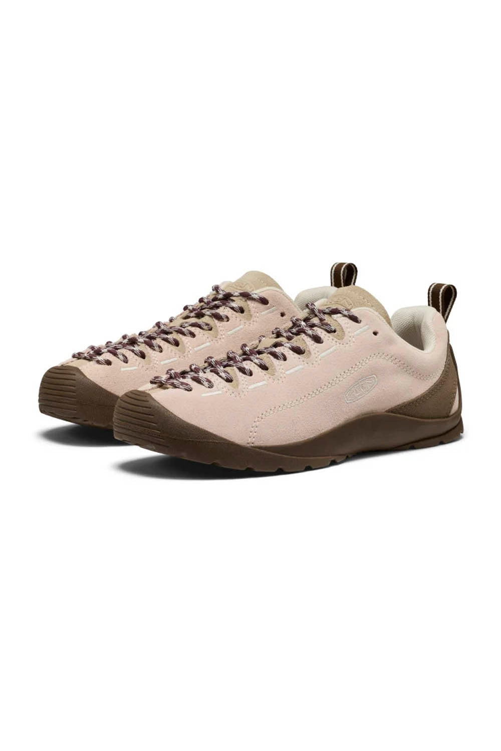 A pair of low-top lace-up shoes in a light blush pink and brown colorway, shown from a three-quarters angle on a white background.