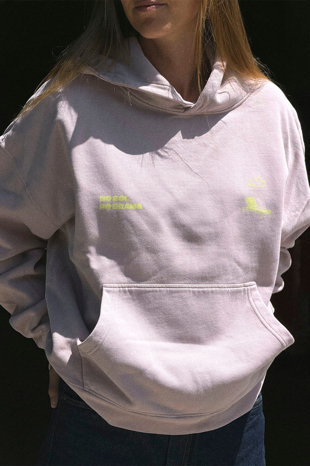 Light gray hoodie with yellow text and logo on a black background
