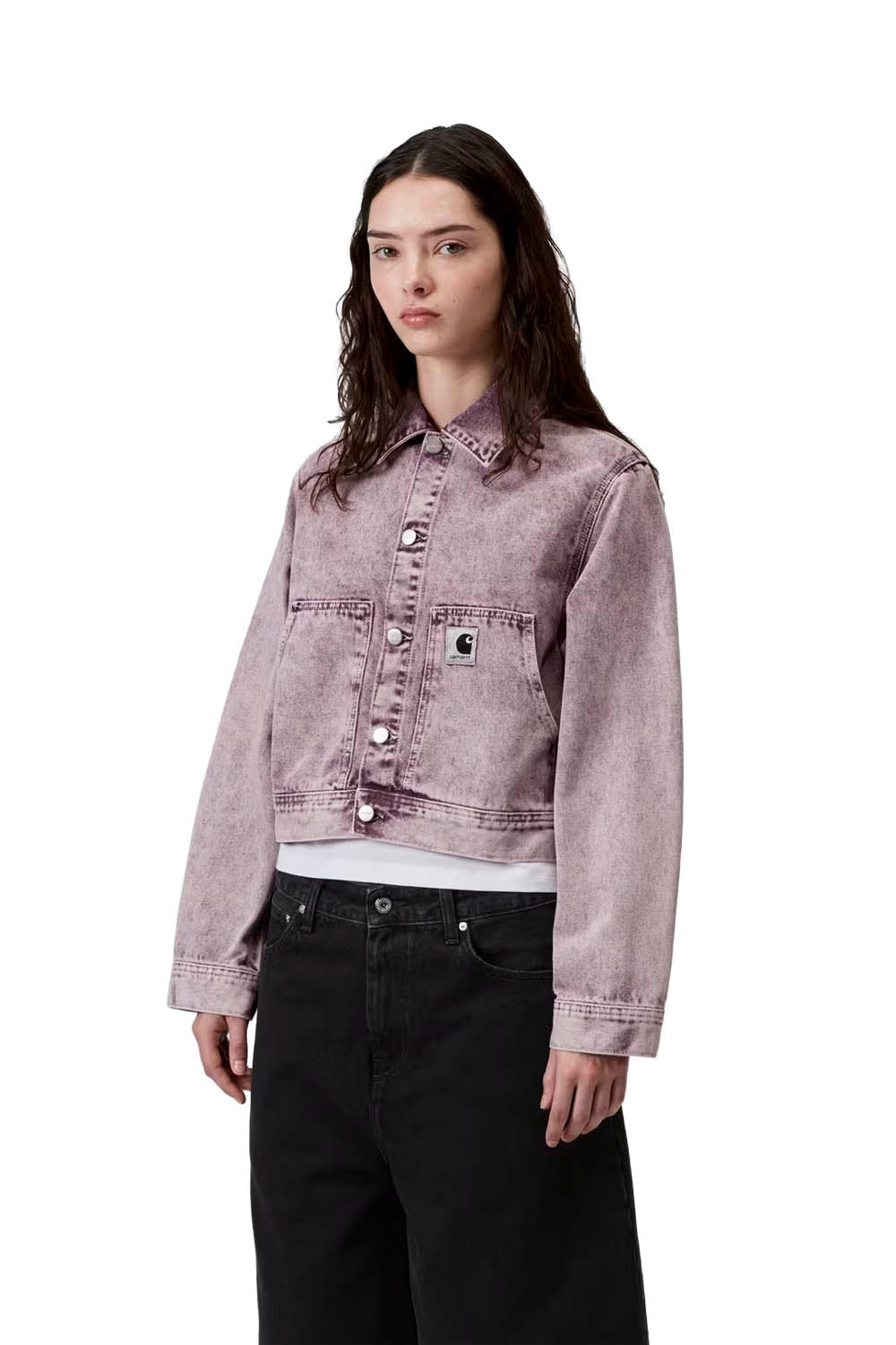 Woman wearing a light purple denim jacket on a white background