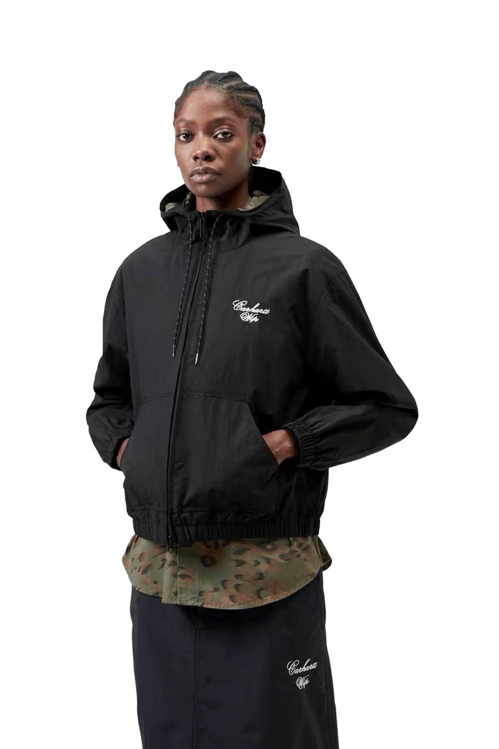 Person wearing a black jacket with a brand logo on a white background