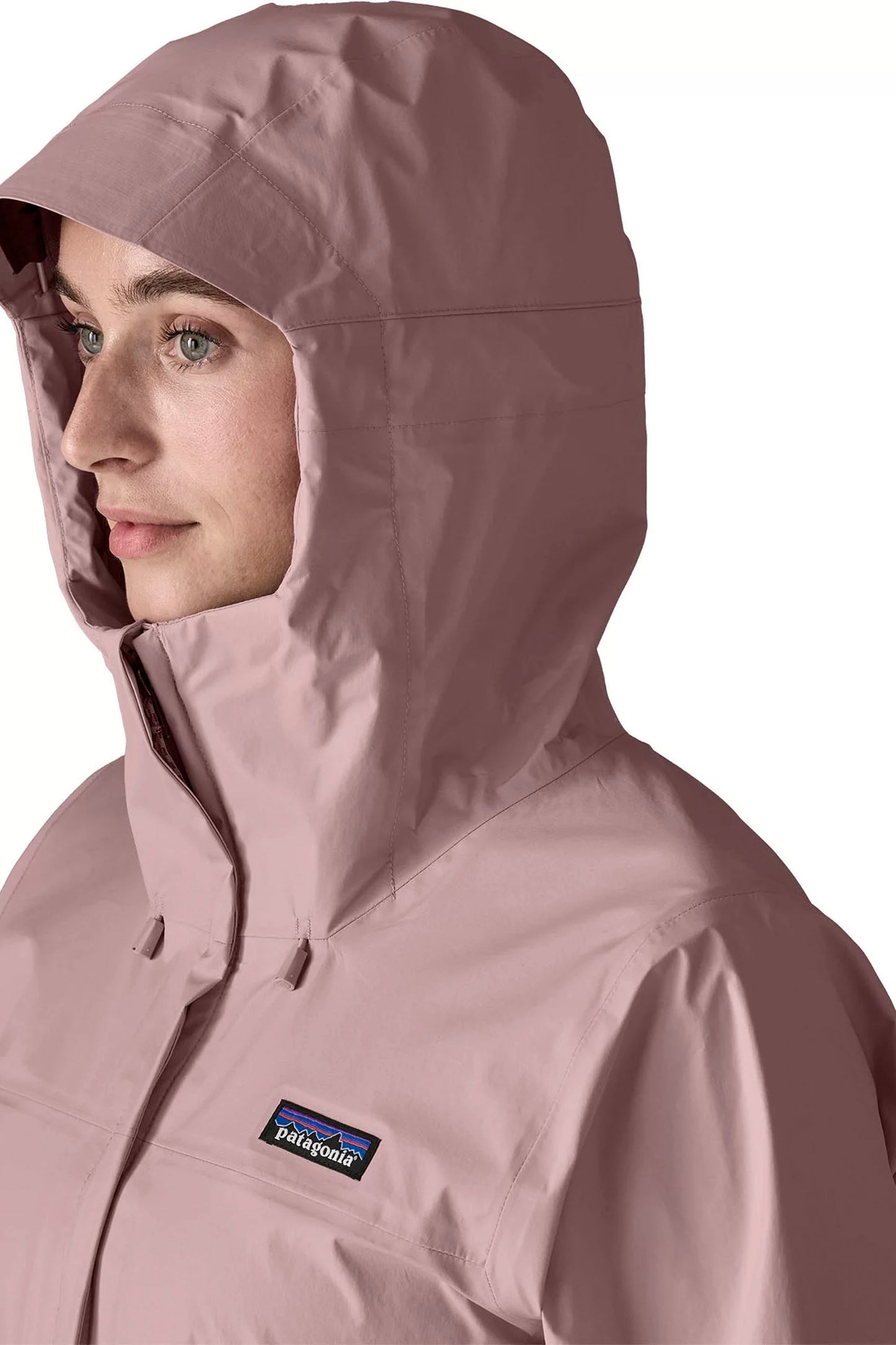 Person wearing a PATAGONIA Torrentshell 3L Rain Jacket in quiet violet colour  on a white background