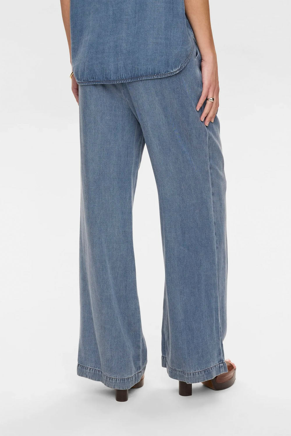 NÜMPH Nuelida Pants in Snow Washed Denim – women's relaxed fit washed denim trousers, available at Pukas Surf Shop