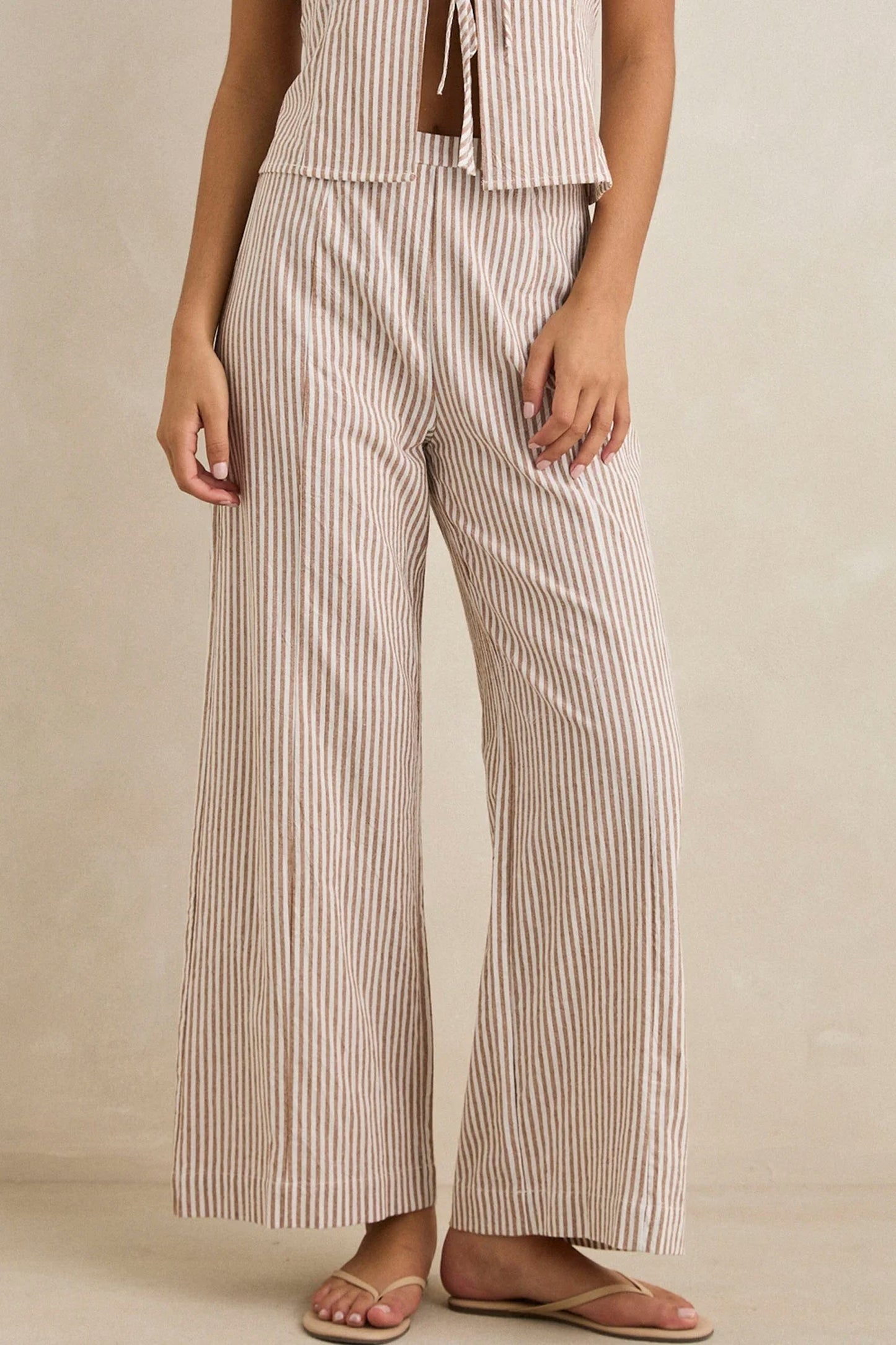 RHYTHM Louise Wide Leg Pant in tan featuring flowing silhouette and warm coastal style