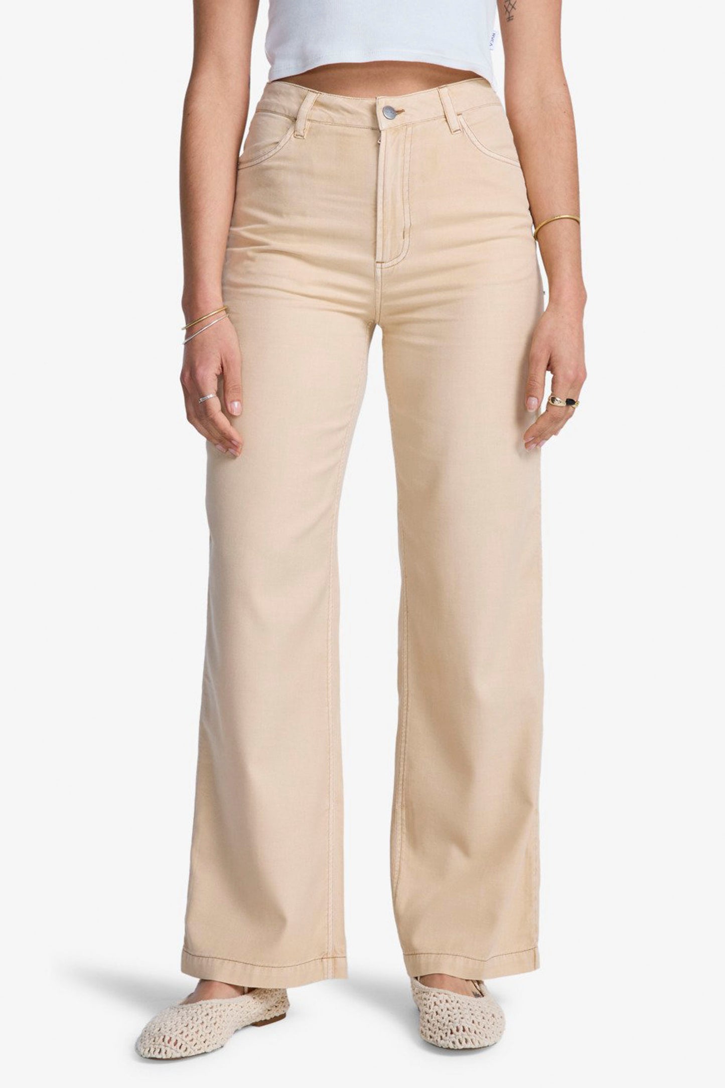 RVCA Coco Pant in Hazelnut - woman wearing flared cotton pants with distressed details, side view