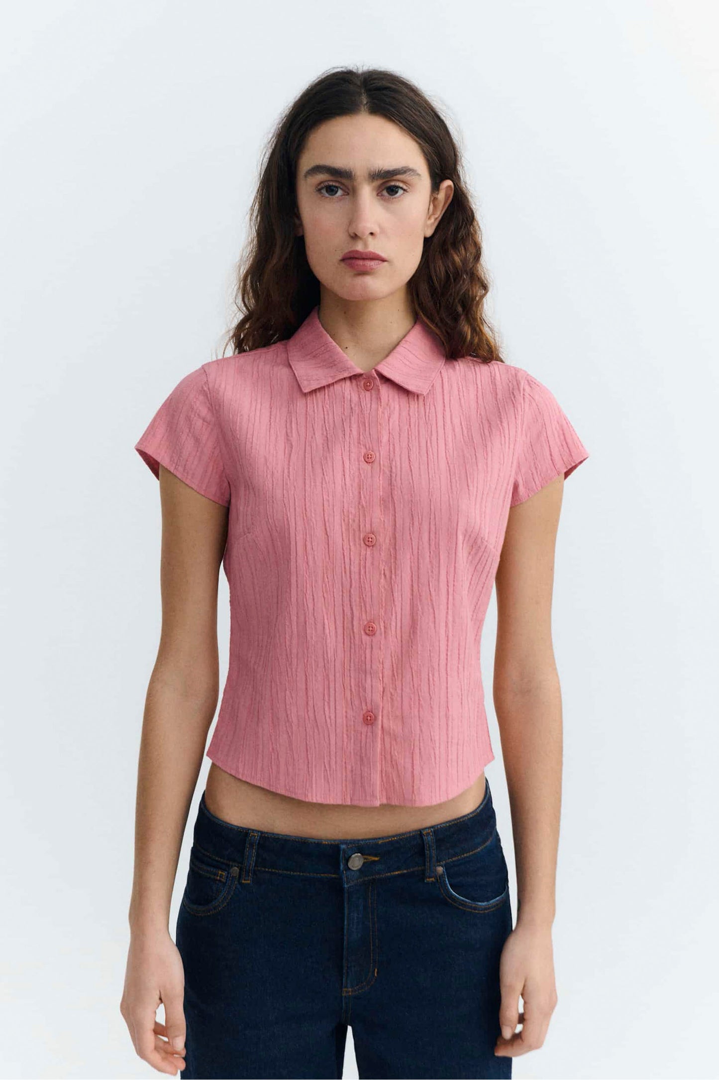 Woman wearing Pink Thinking Mu Kitty shirt on a white background