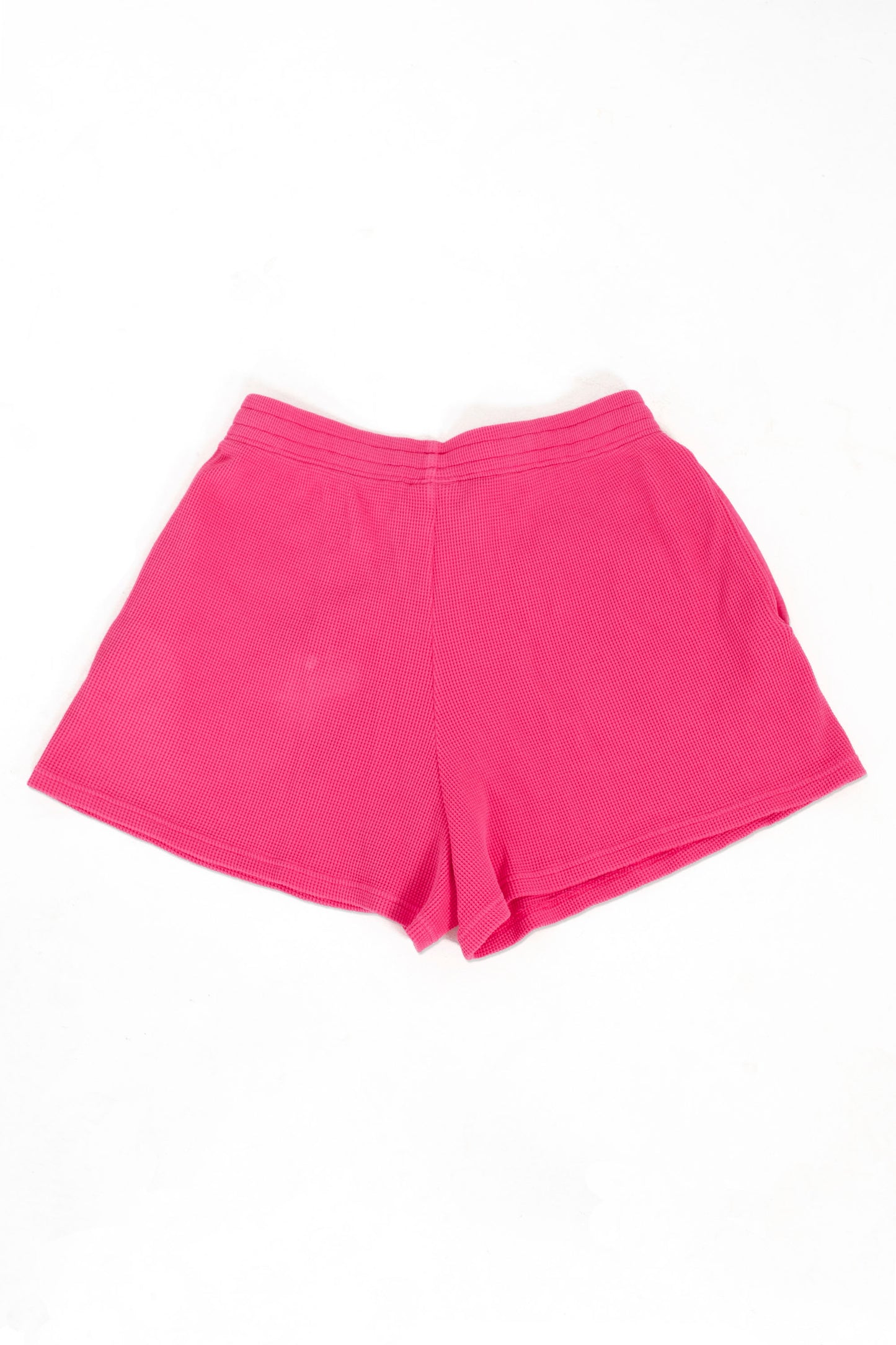 Pink shorts on a white background