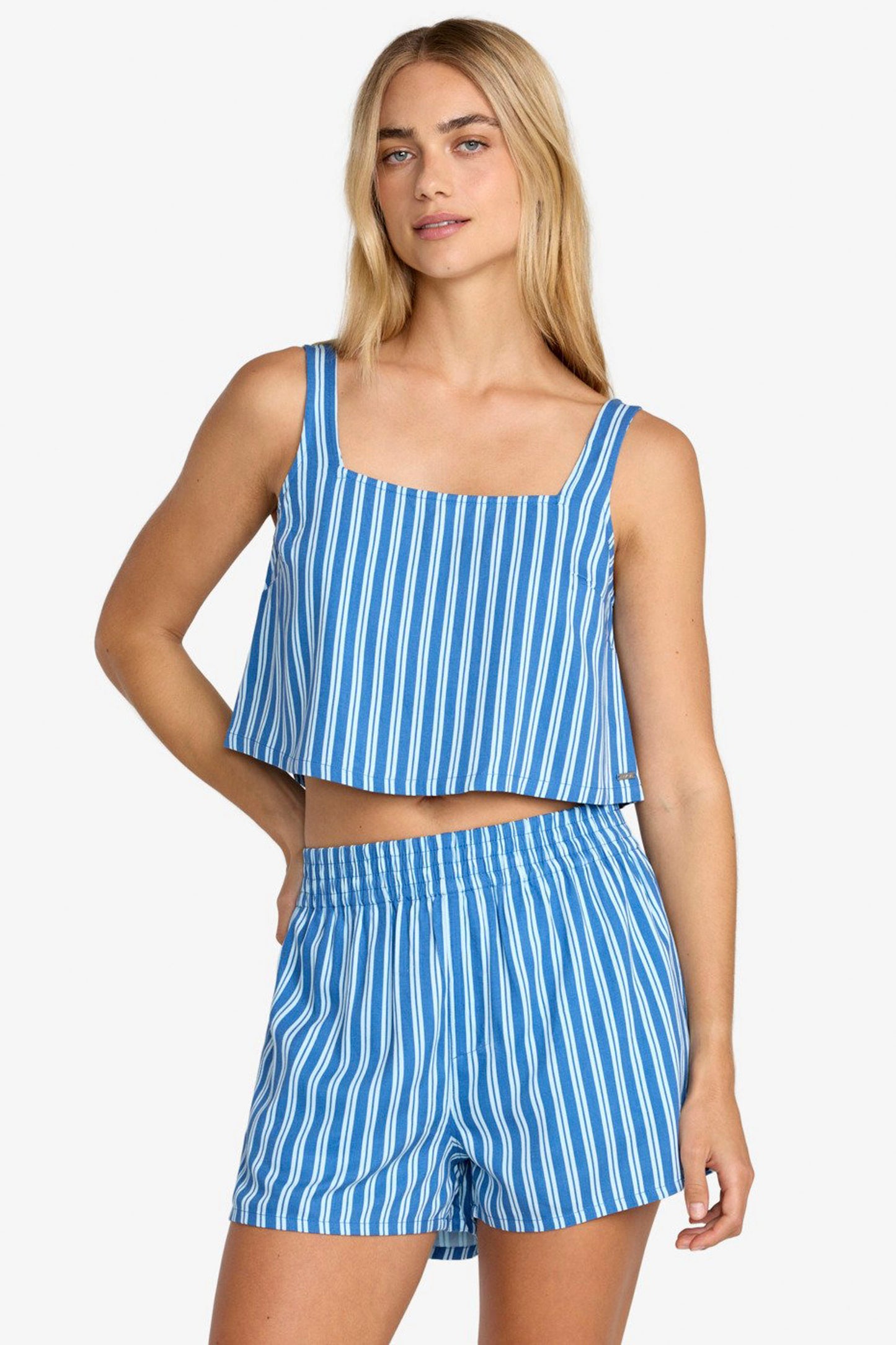 Woman wearing a RVCA Mikey Boxer Short relaxed fit on a white background